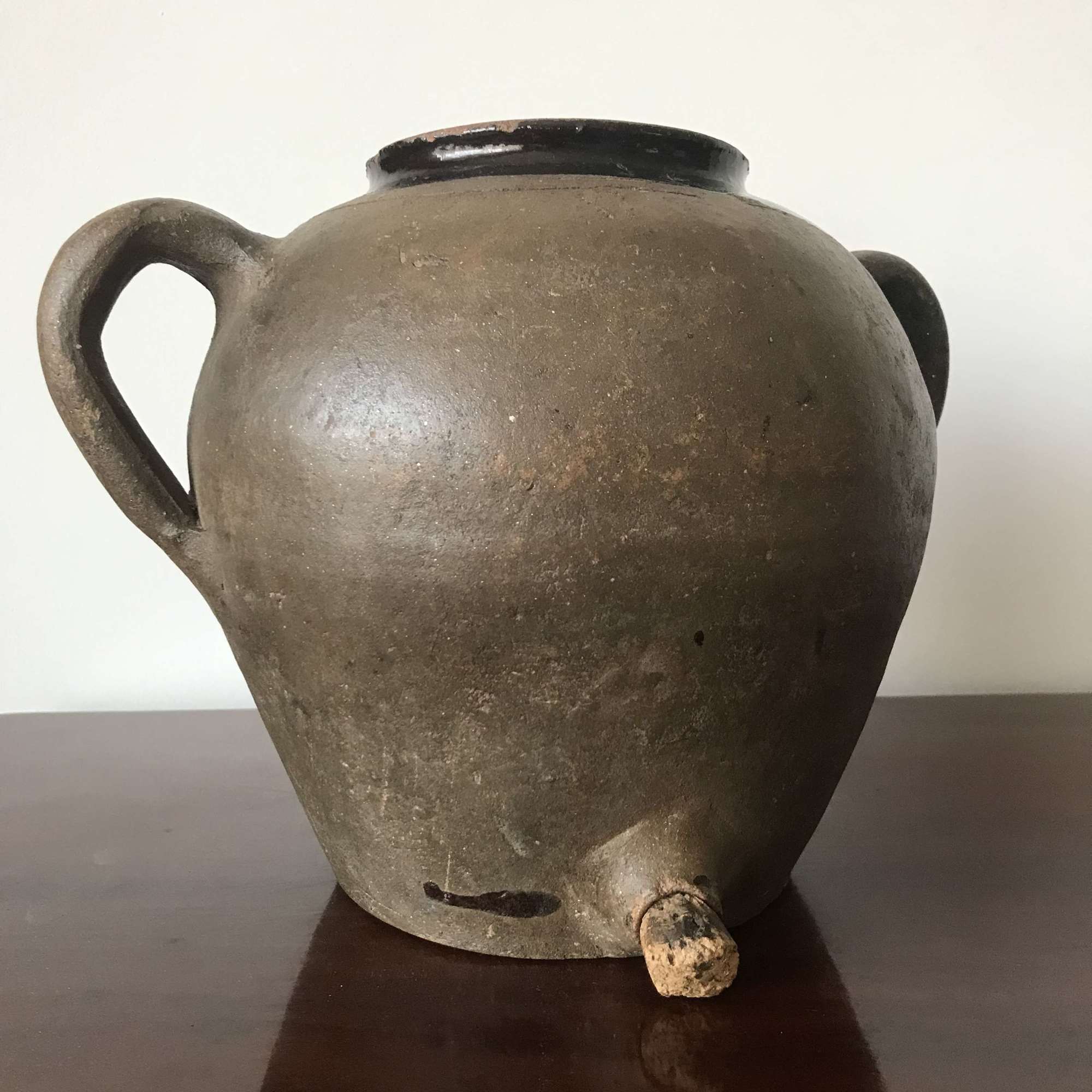 Antique oil jar with tap & bung.