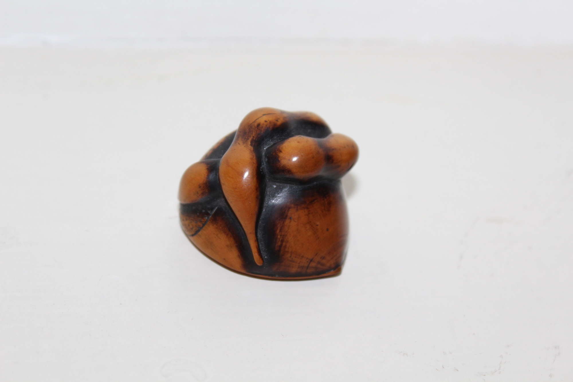 Finely carved wood netsuke of a cluster of nuts 19th century