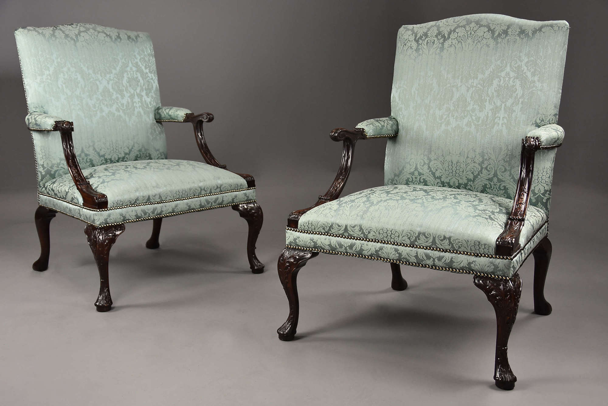 Fine pair of mahogany Gainsborough armchairs in the George II style