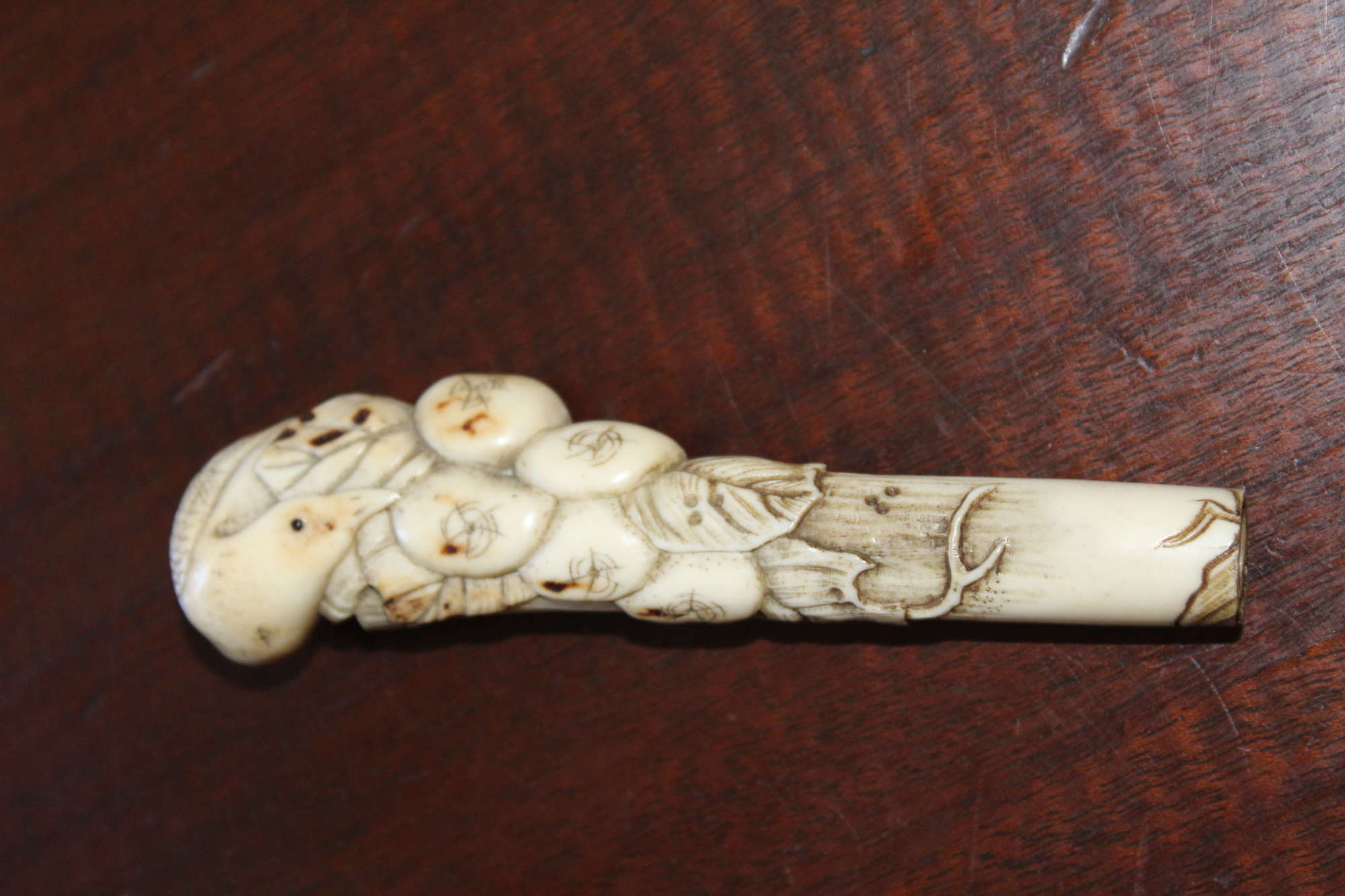 A Finely Carved 19th Century Oriental Bone Cane Handle