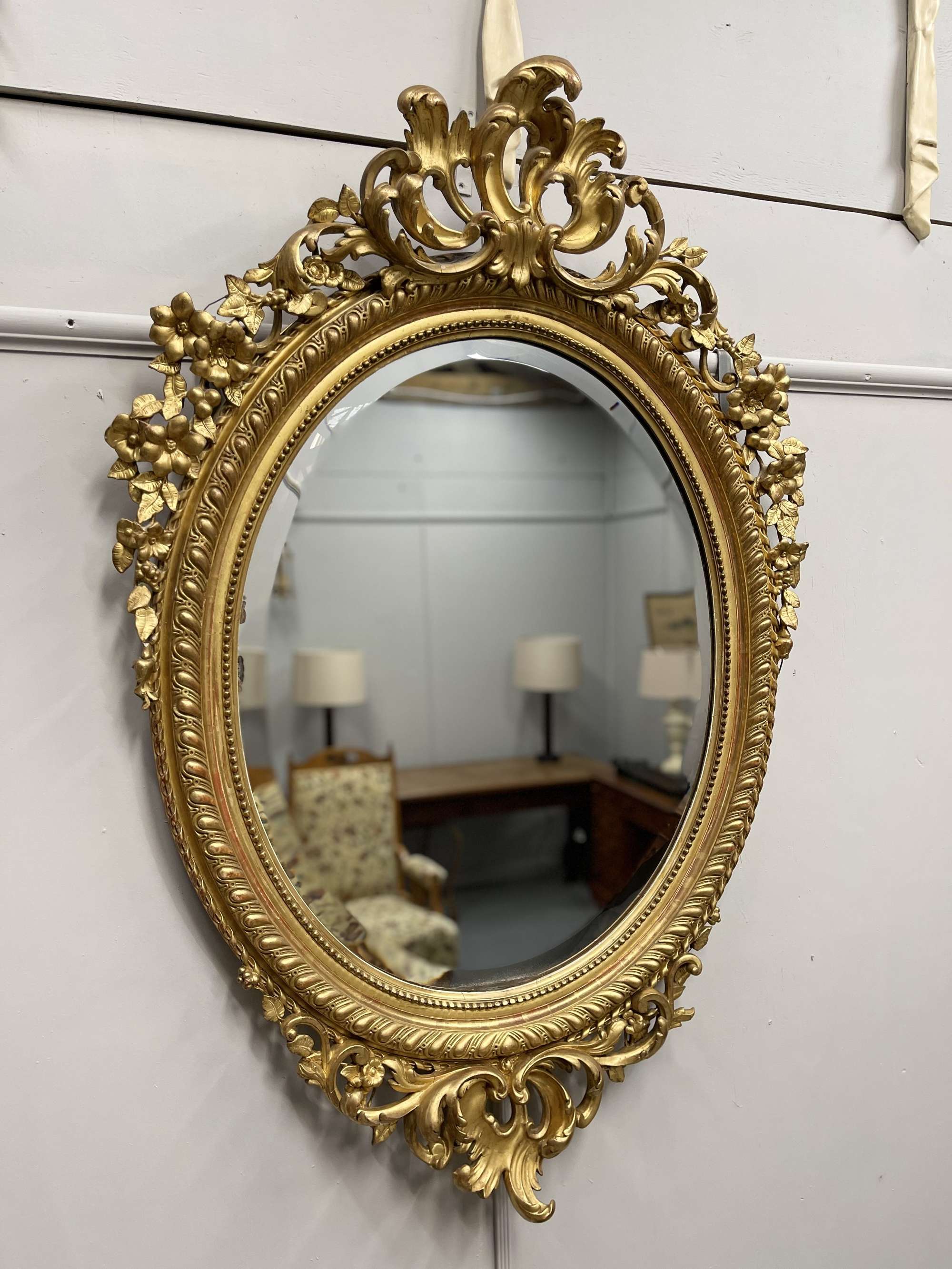 Large French 19th century oval gilt mirror with bevelled glass