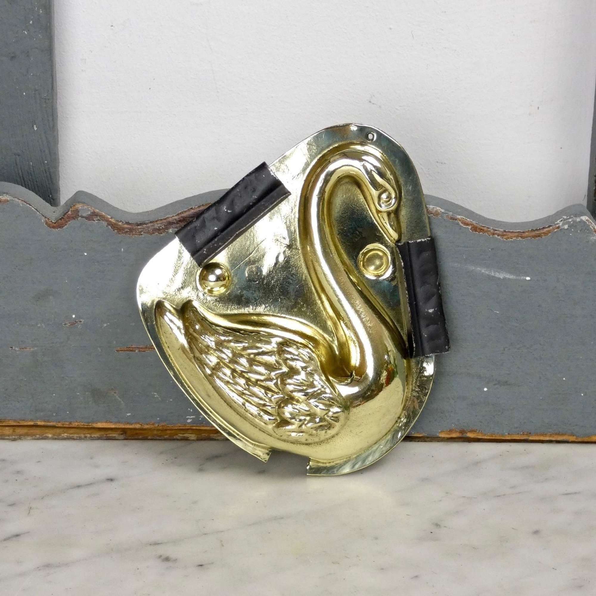 Brass nougat mould of a swan
