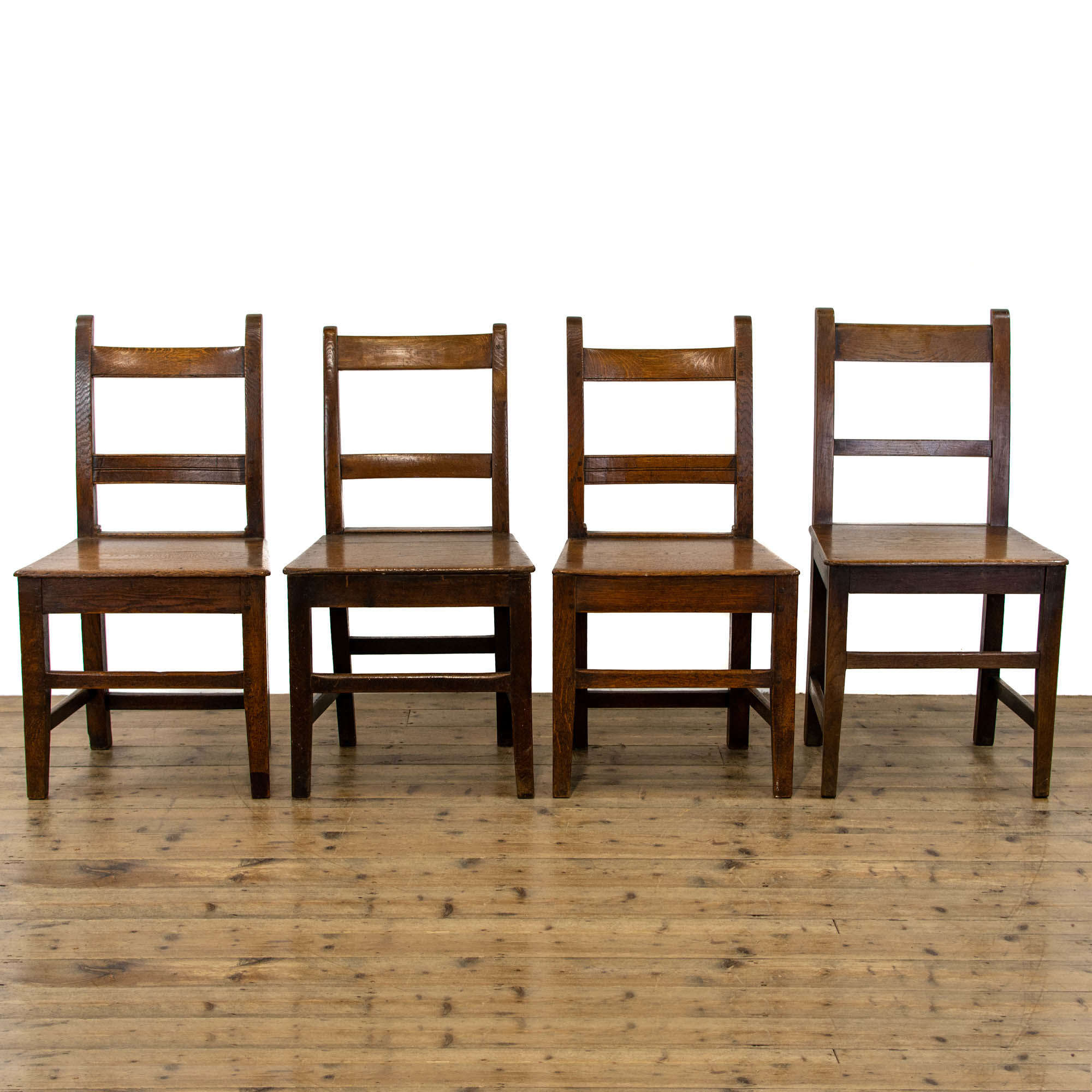 Harlequin Set of Four Antique Oak Farmhouse Chairs