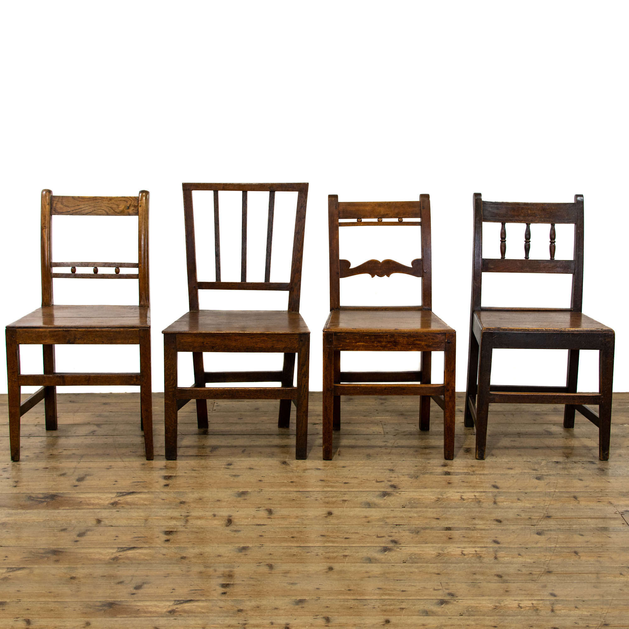 Harlequin Set of Four Antique Welsh Oak Farmhouse Chairs