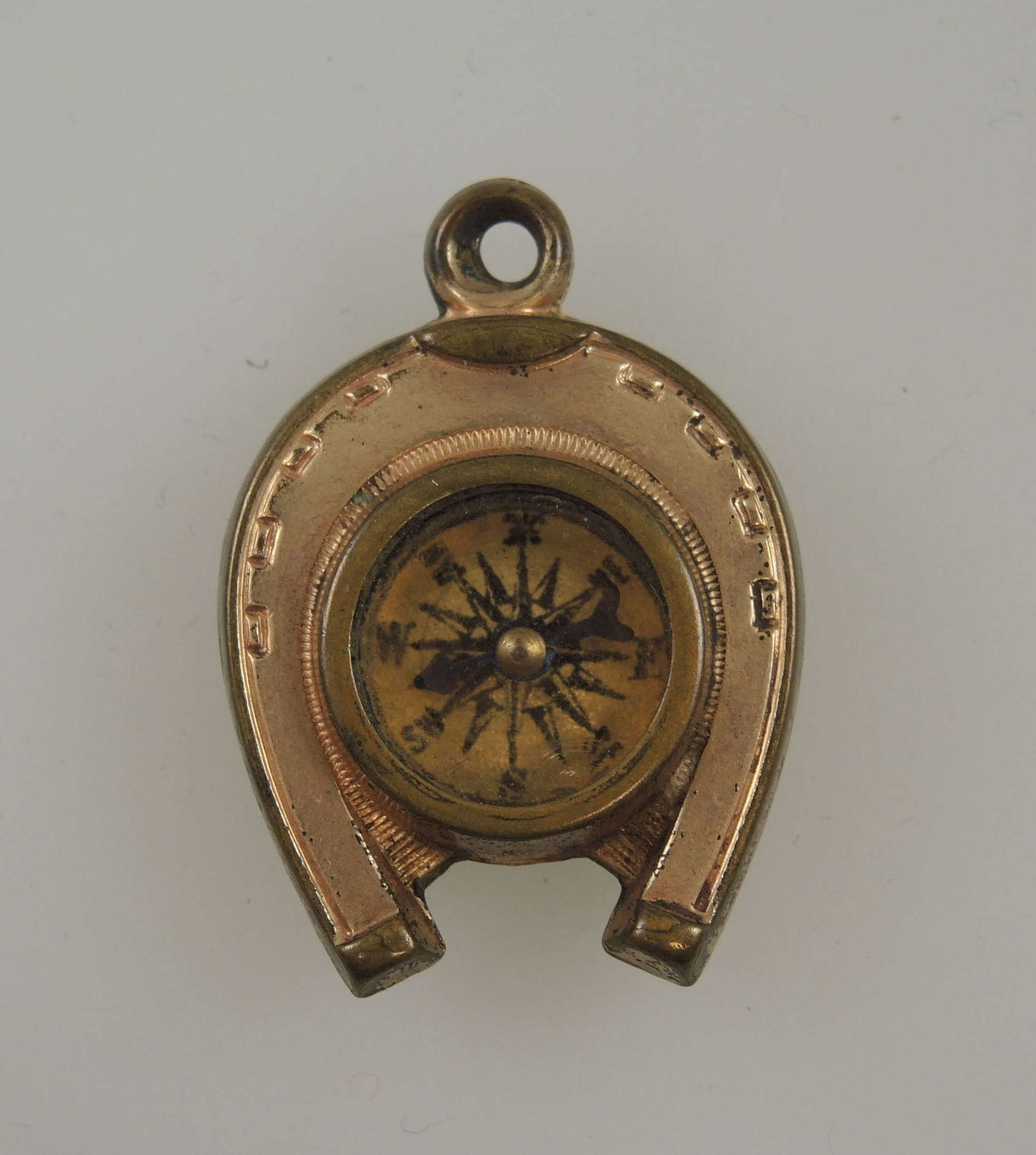 Victorian gilt metal compass fob with horse motifs c1890