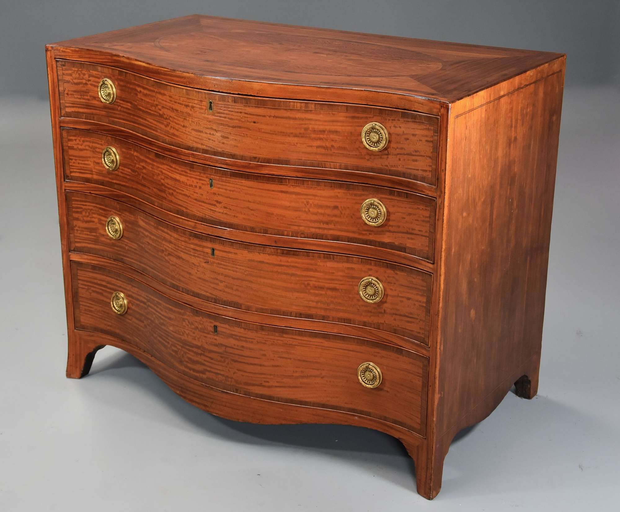Superb quality serpentine shaped satinwood gentleman's dressing chest