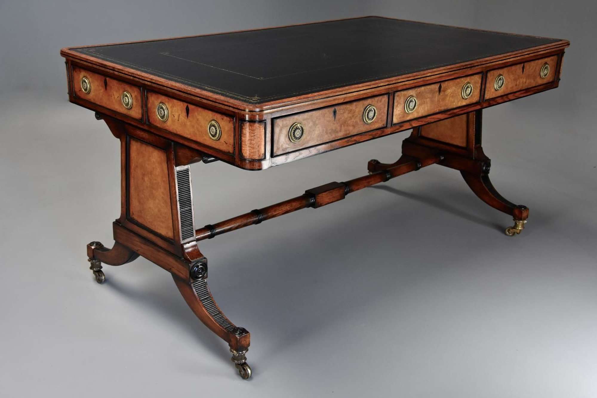Fine quality Regency style six drawer oak writing table