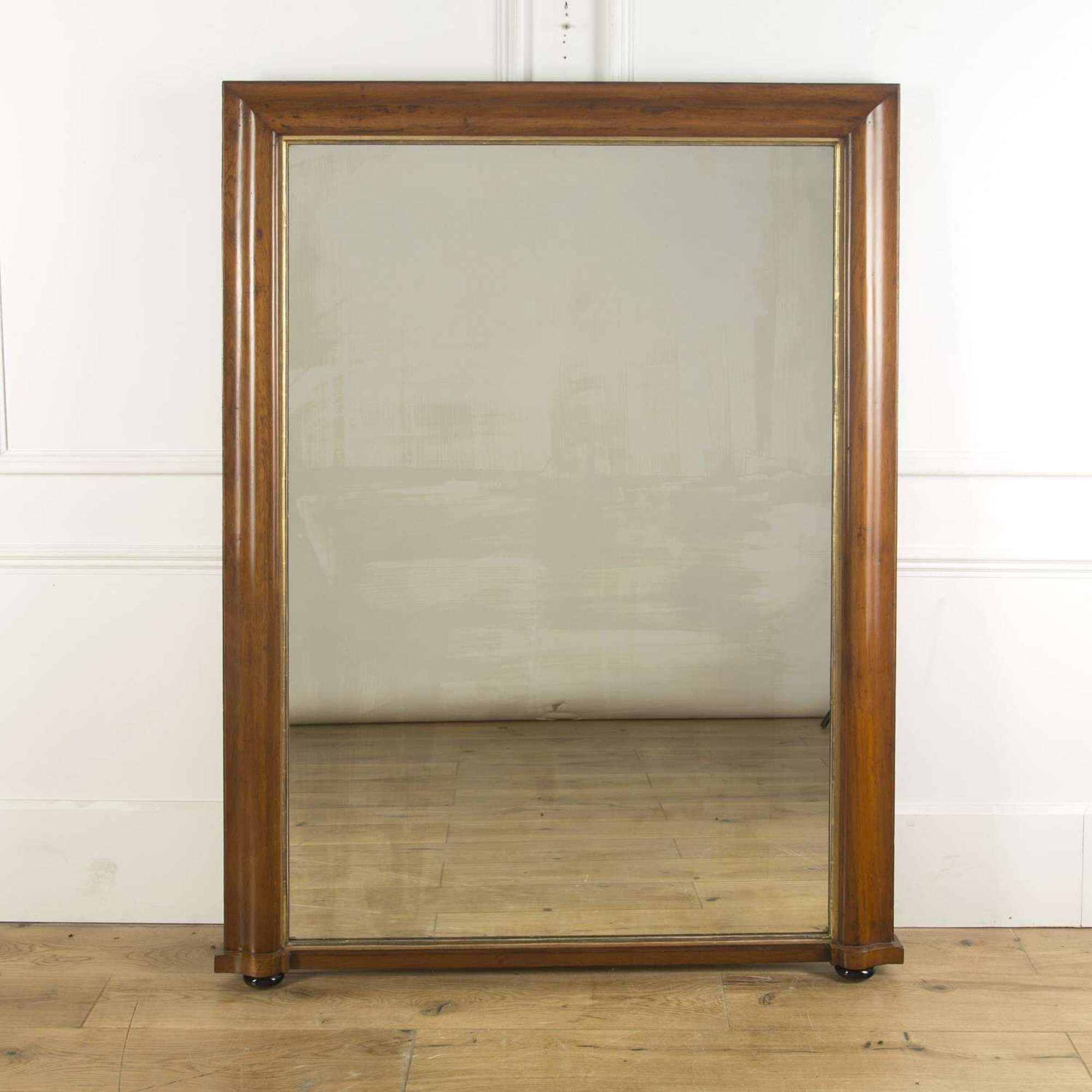 A large over mantle mirror