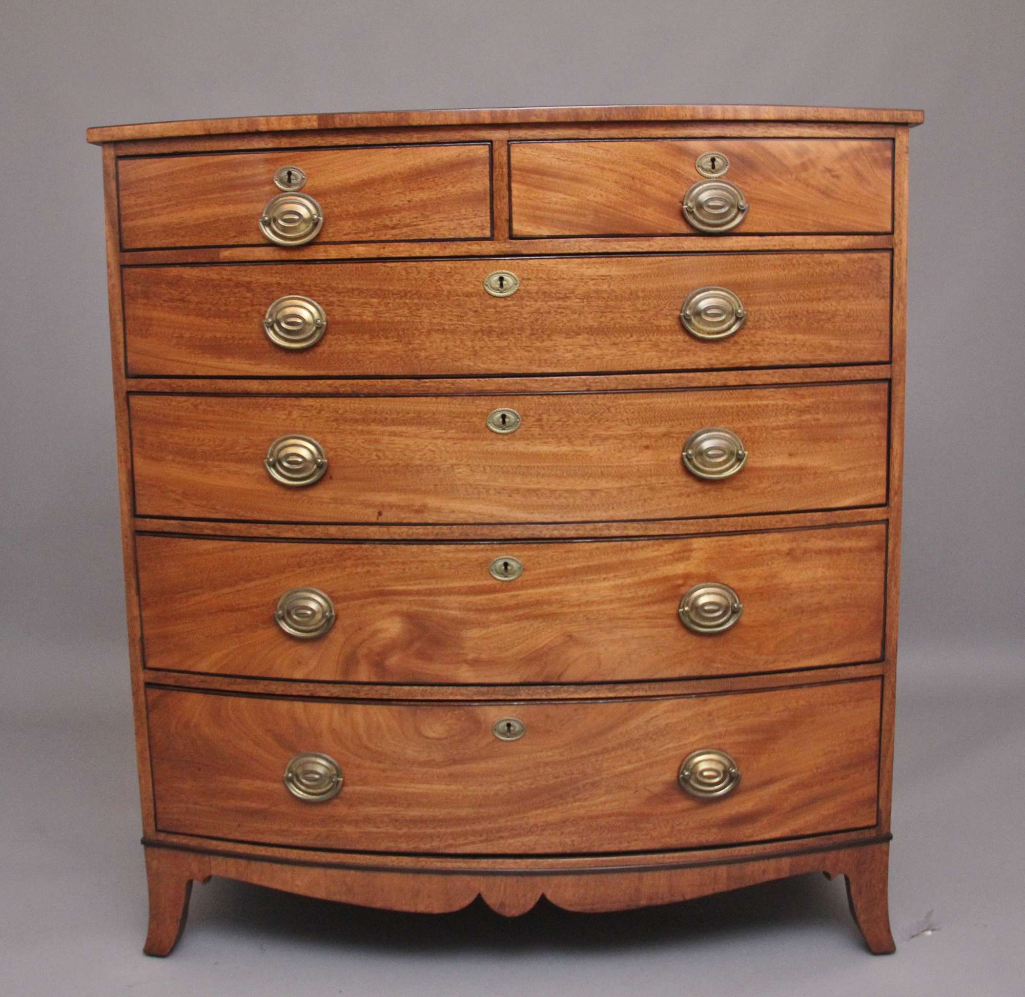 A Superb Quality Early 19th Century Tall Mahogany Bowfront Antique Chest Of Drawers