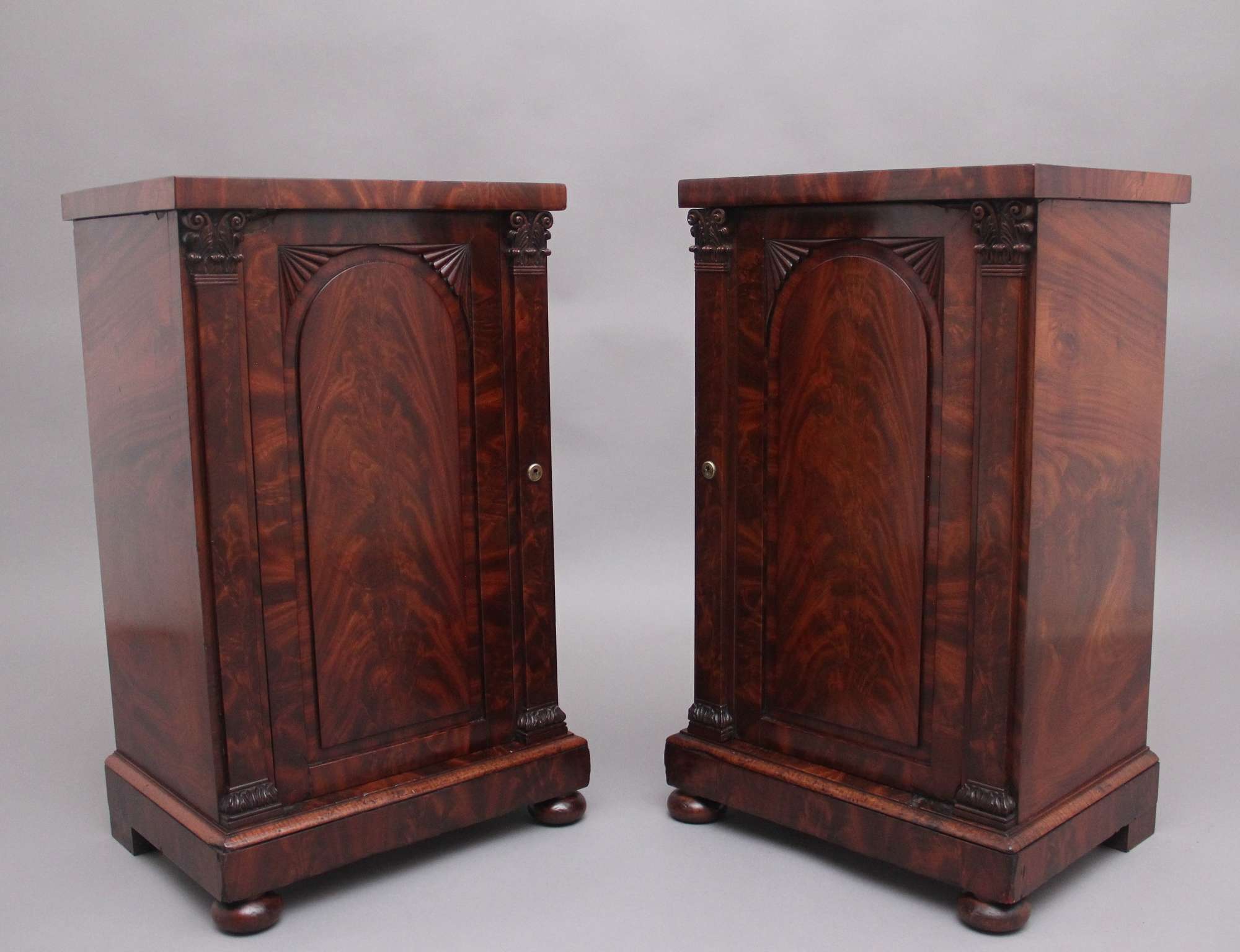 A Pair Of 19th Century Flame Mahogany Antique Bedside Cabinets