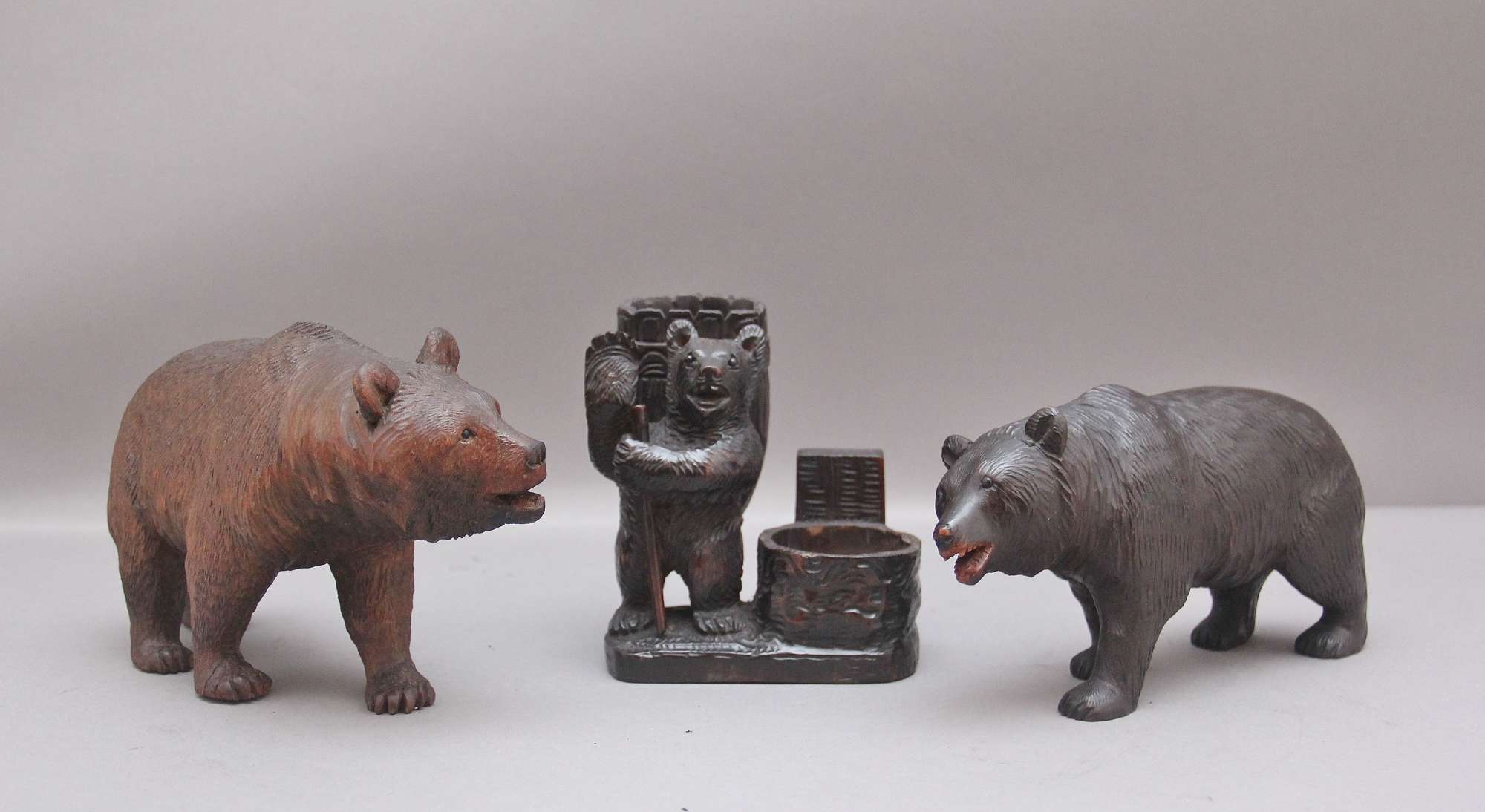 A Set Of Three 19th Century Black Forest Carvings