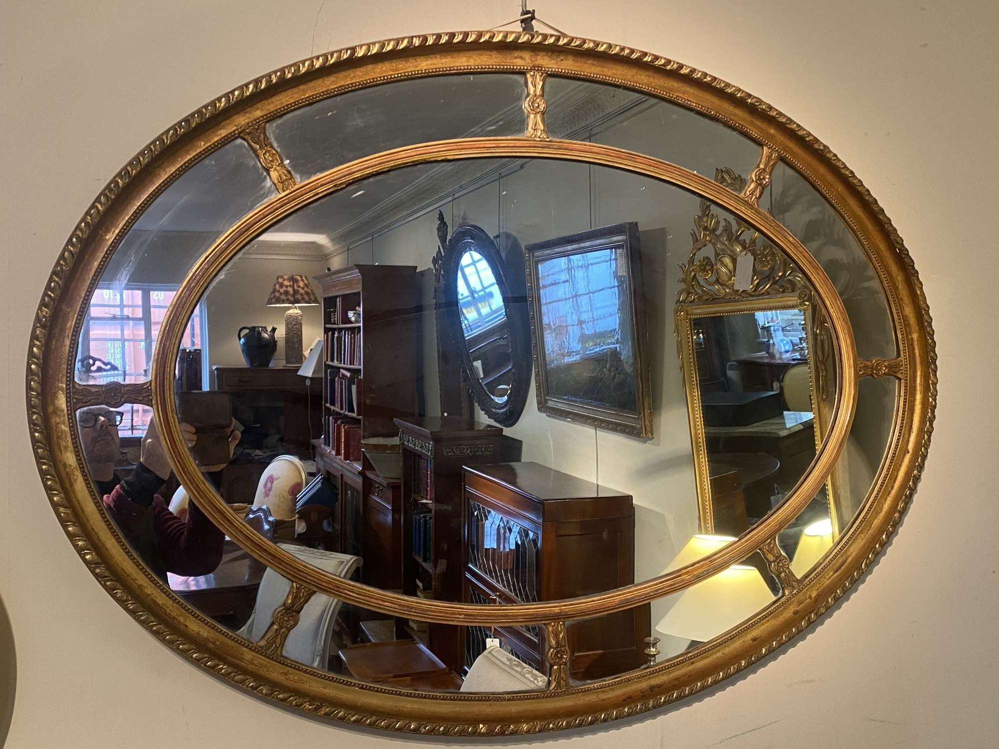 Large oval gilt mirror