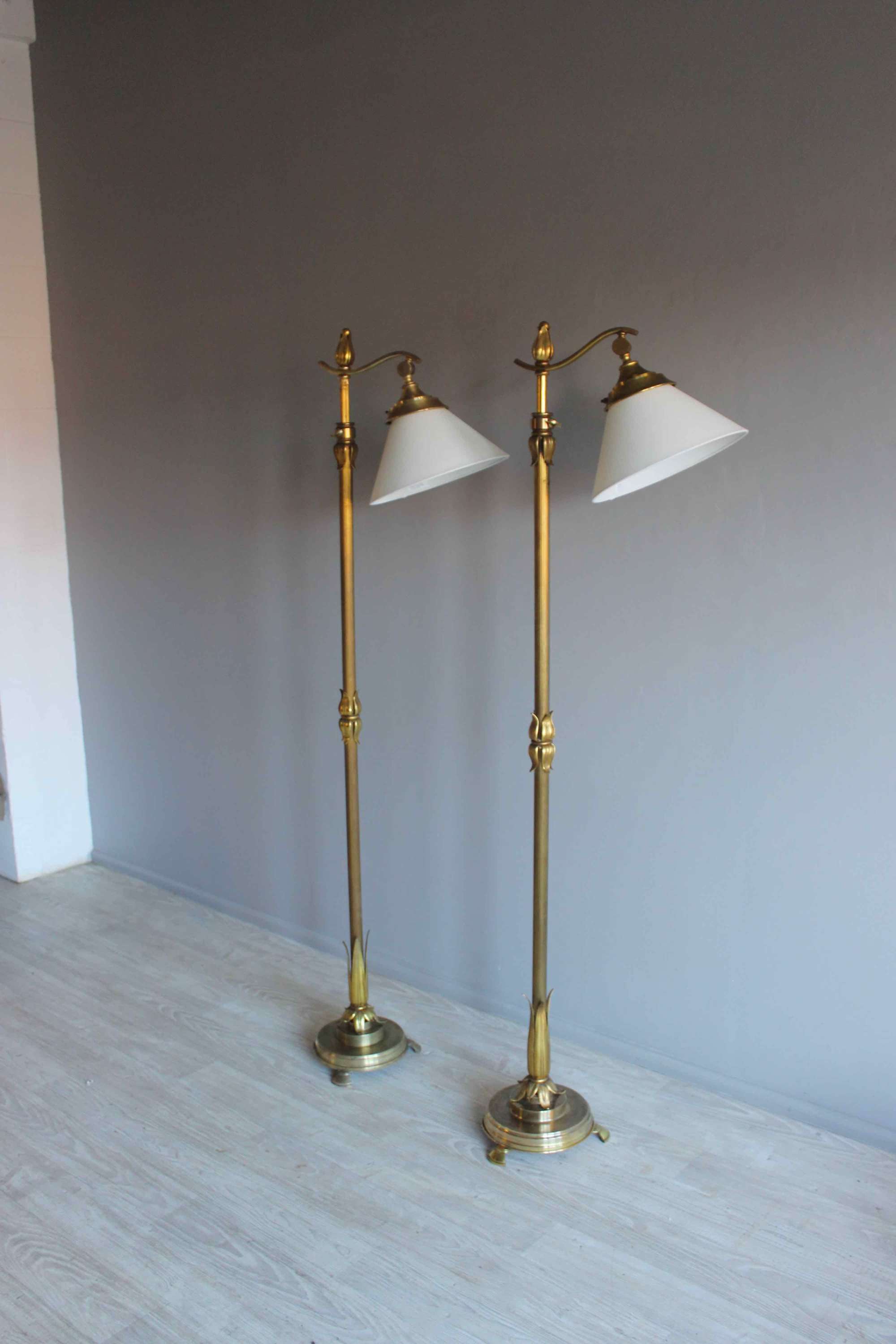 Substantial pair of gilded brass adjustable floor lamps