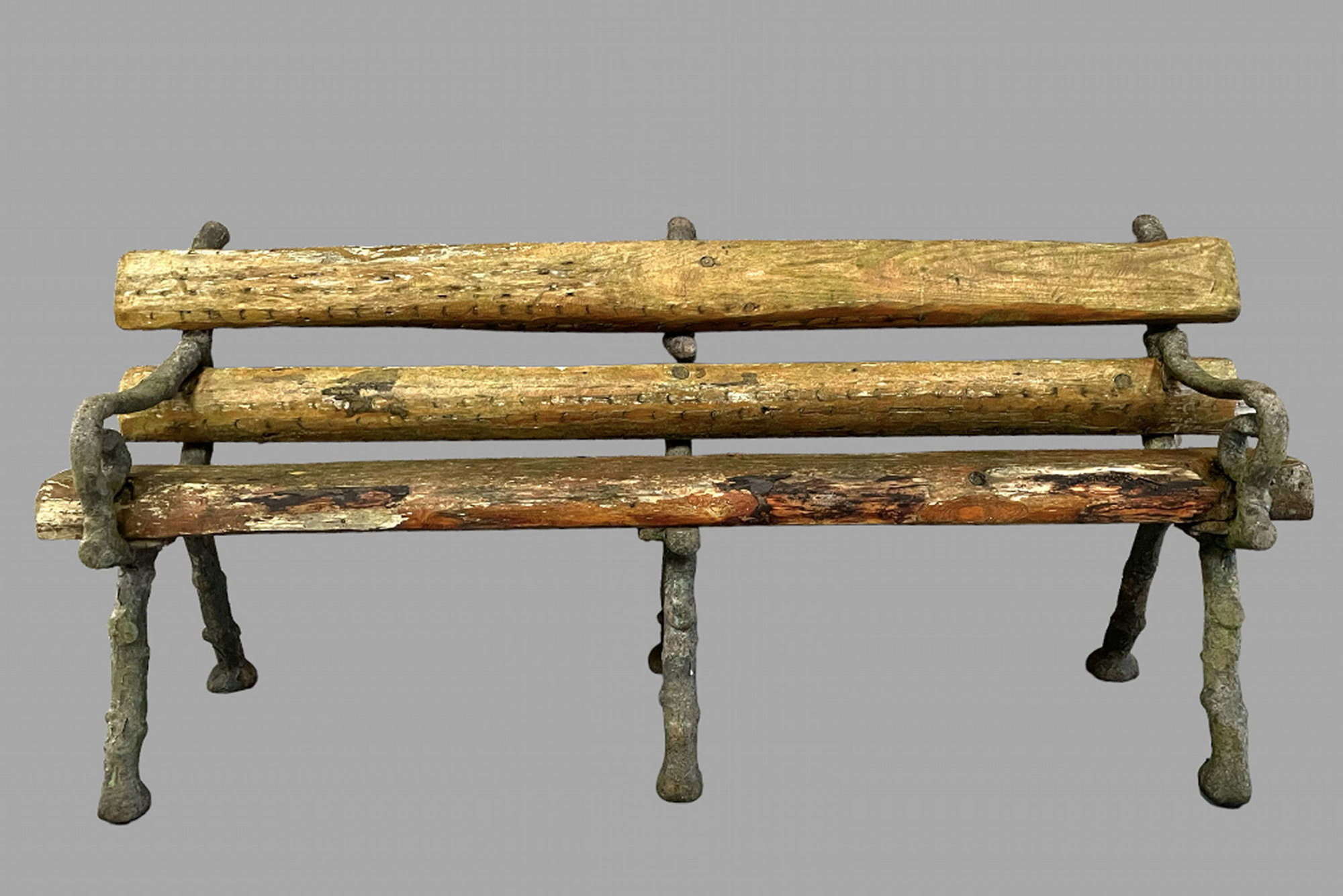 An Iron and Wooden Log Garden Seat