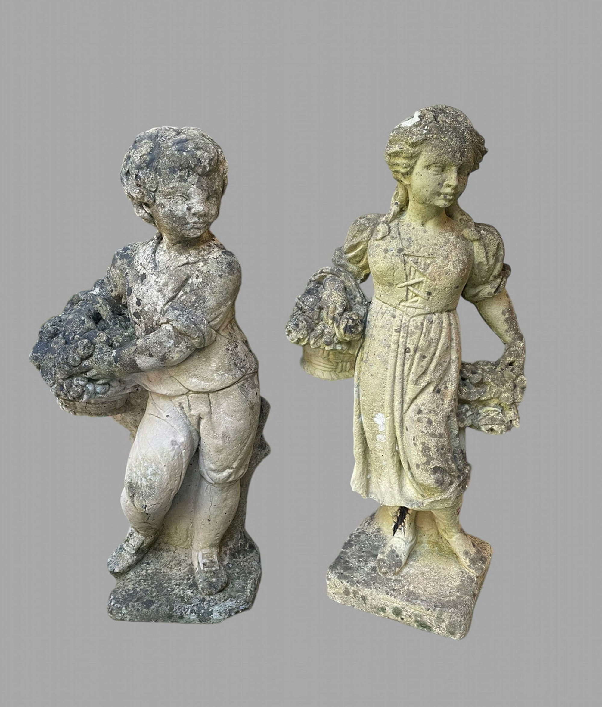 A Stone Boy and Girl Garden Figures