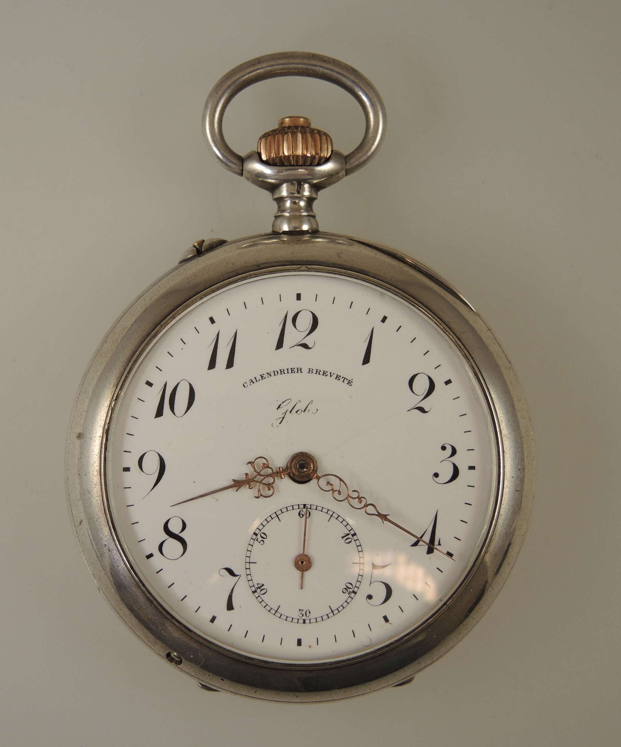 Silver pocket watch with a double sided calendar function c1890