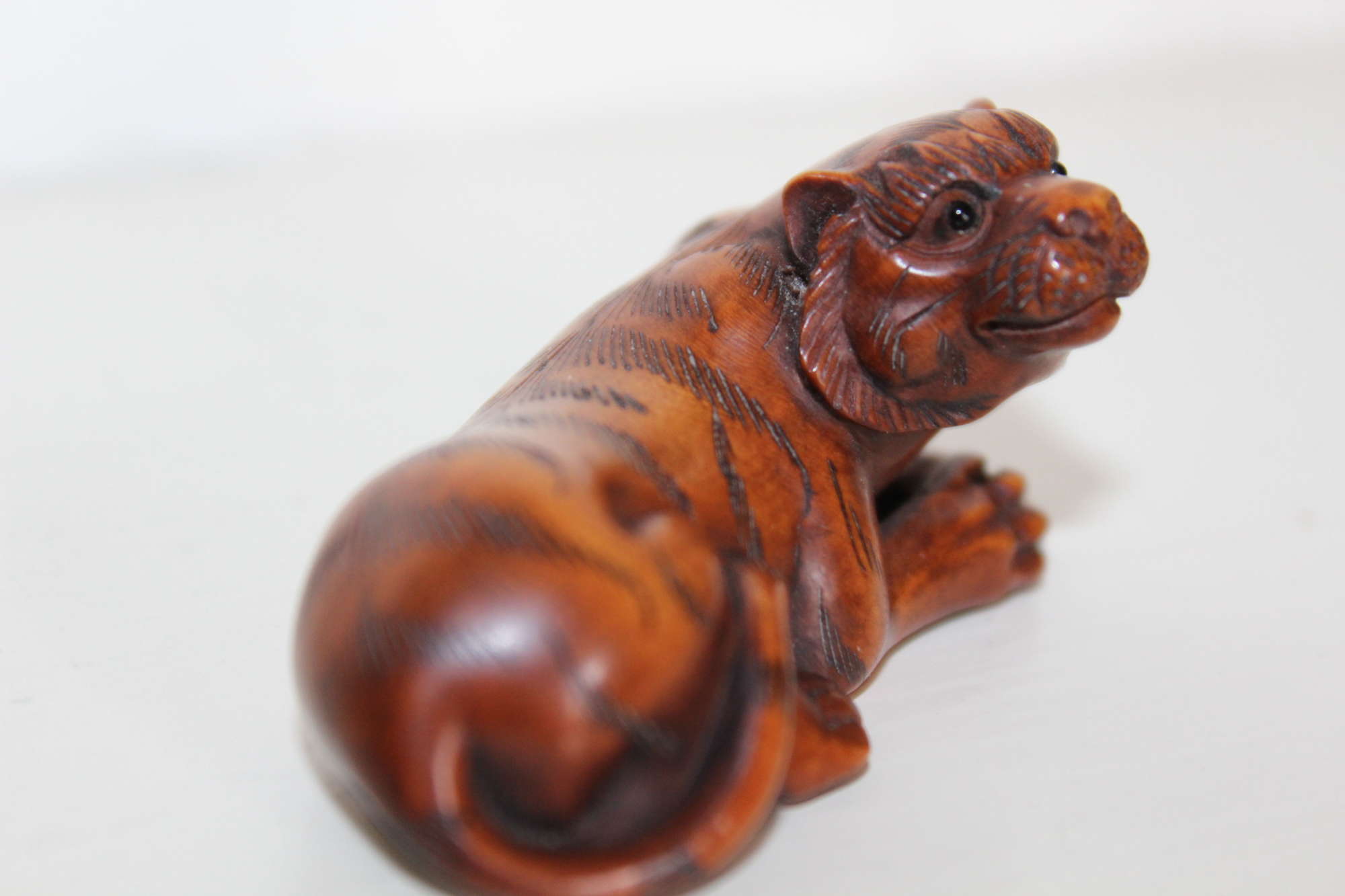 A Finely Carved Boxwood Meiji Period Netsuke Of A Tiger