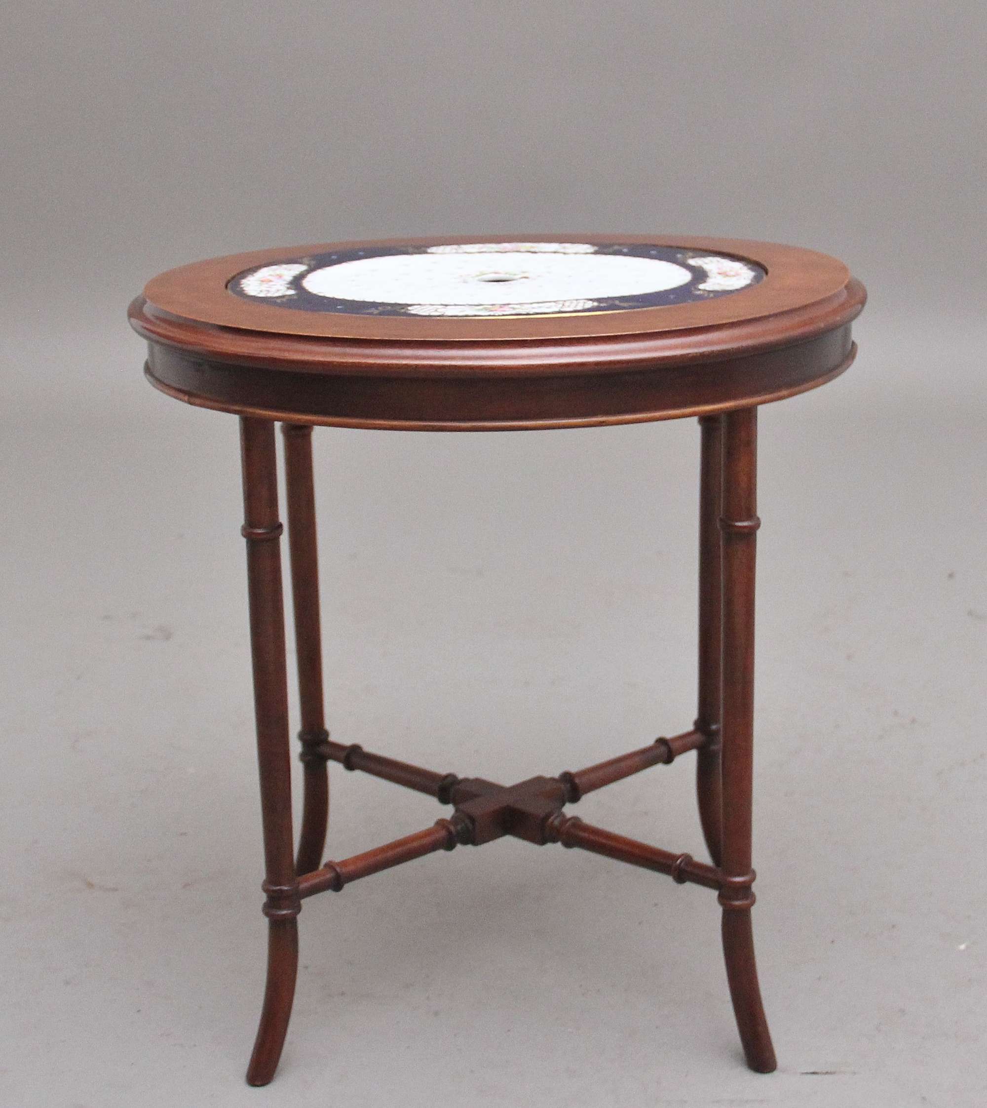 Early 20th Century mahogany occasional table with a ceramic inset