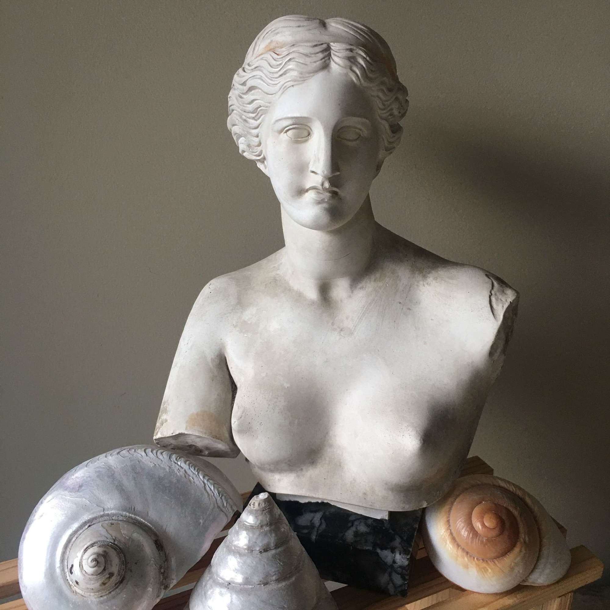 Sculpture of Venus marble composite on marble base