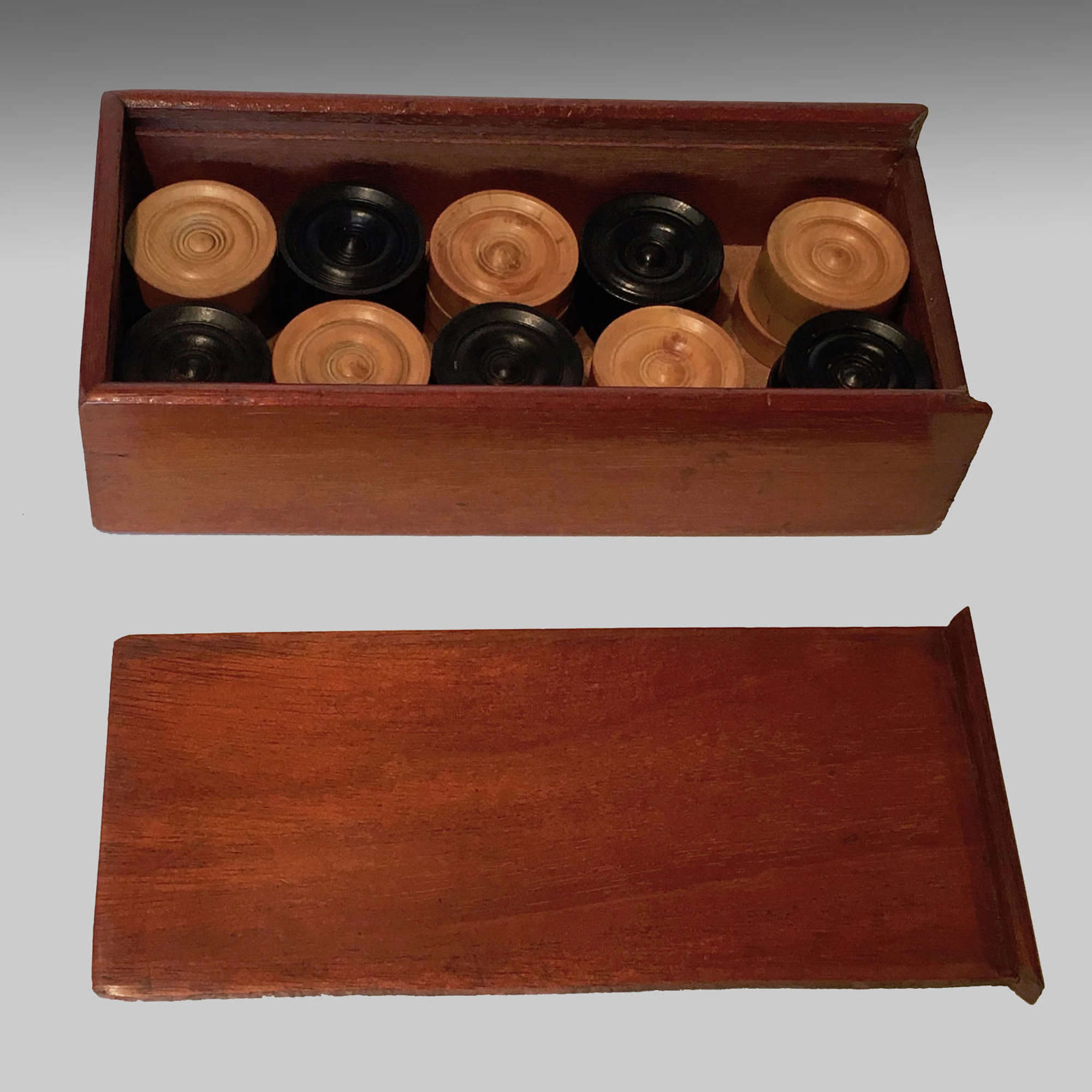 Boxed set of boxwood and ebony backgammon or draughts