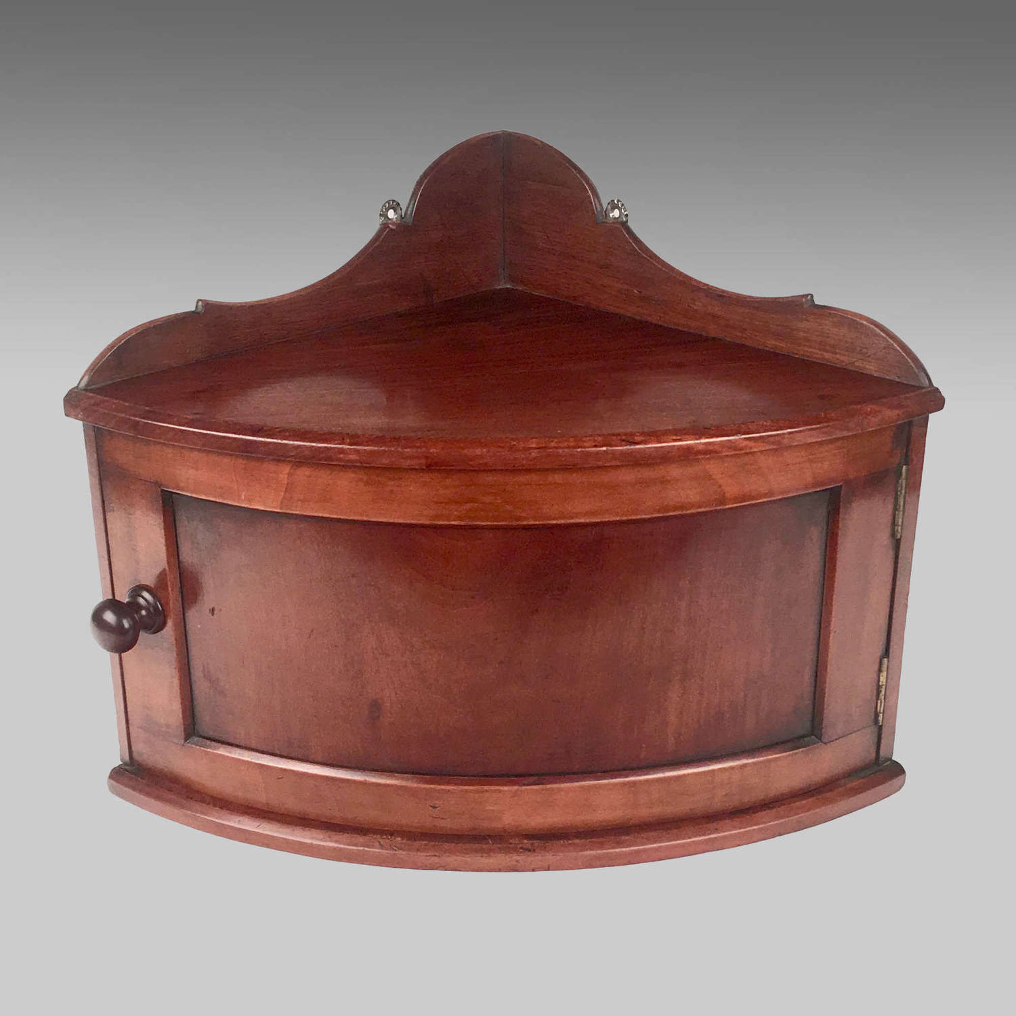 19th century mahogany bow-front corner cabinet