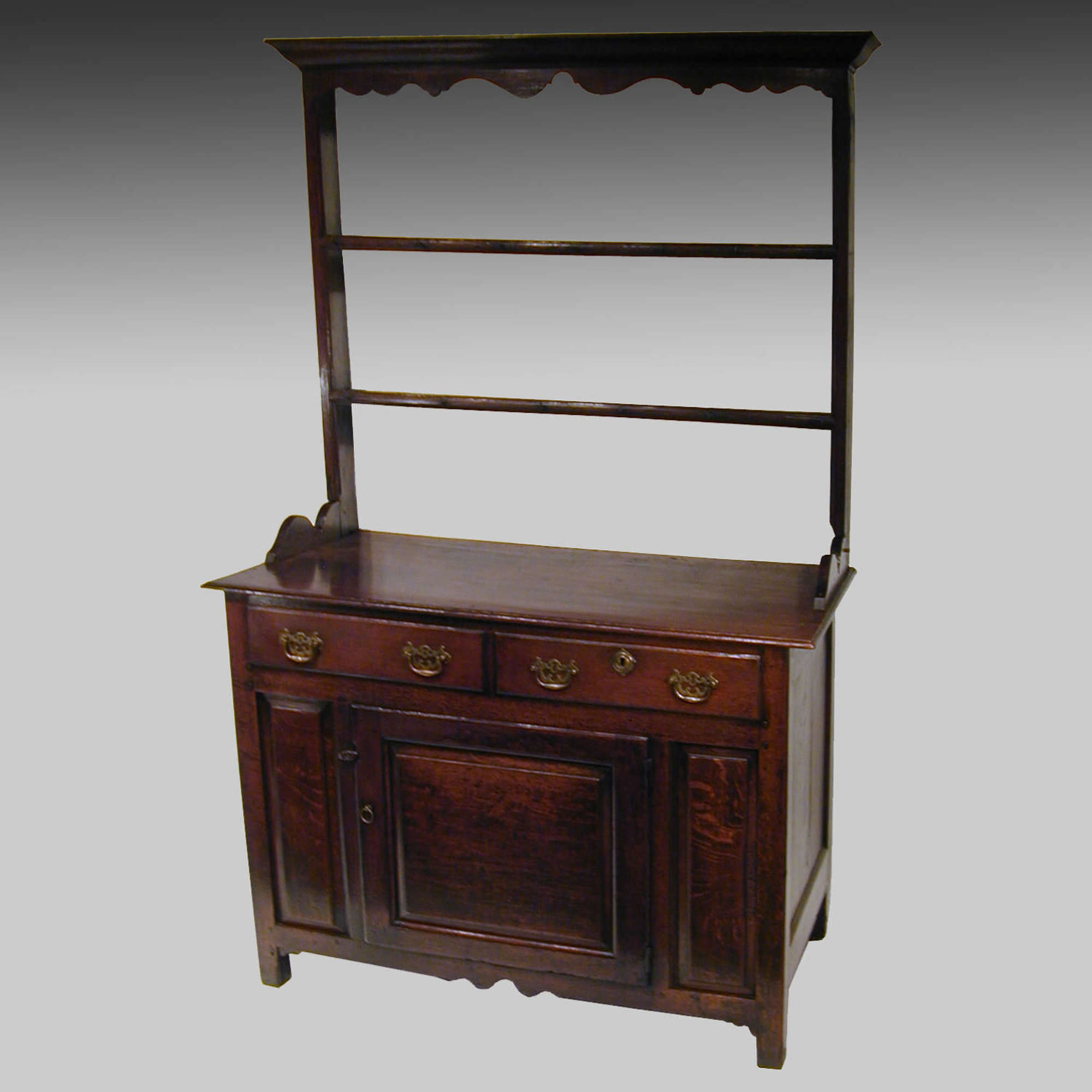 Small eighteenth century oak cupboard dresser and rack
