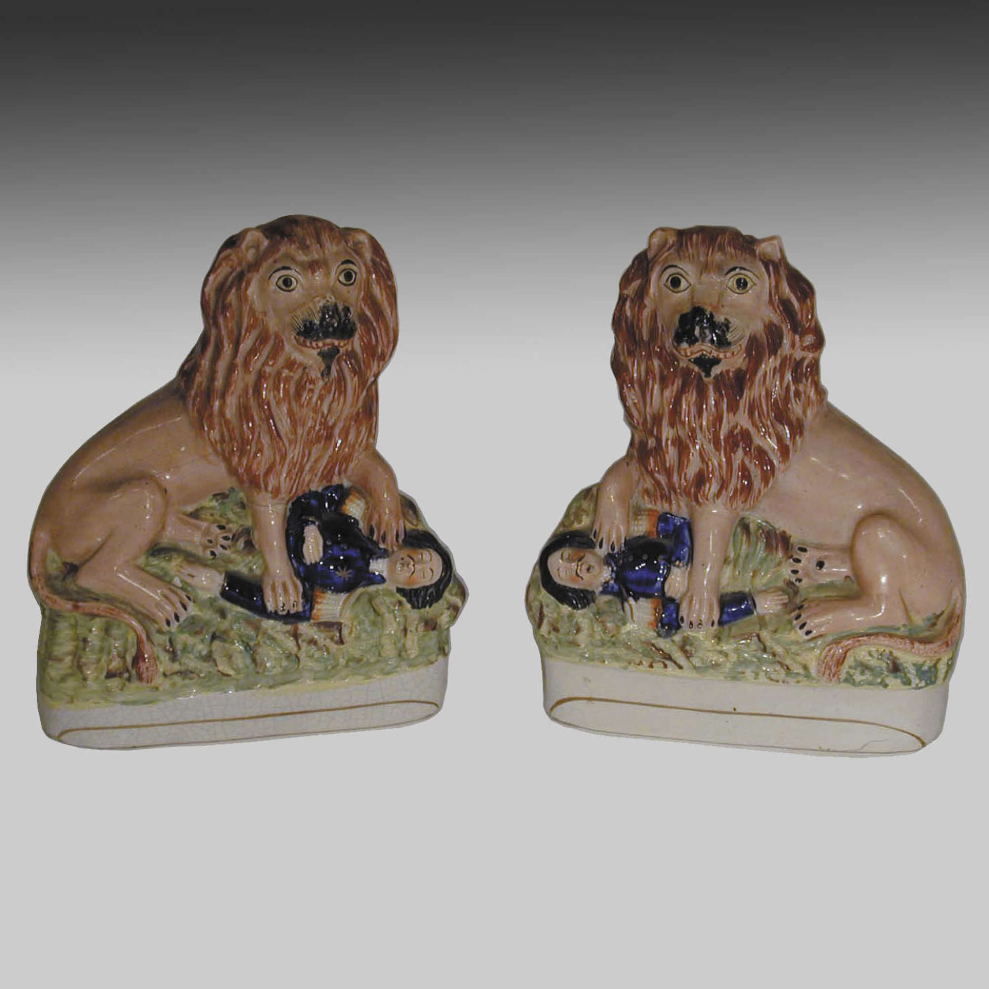 Antique pair Staffordshire pottery lions