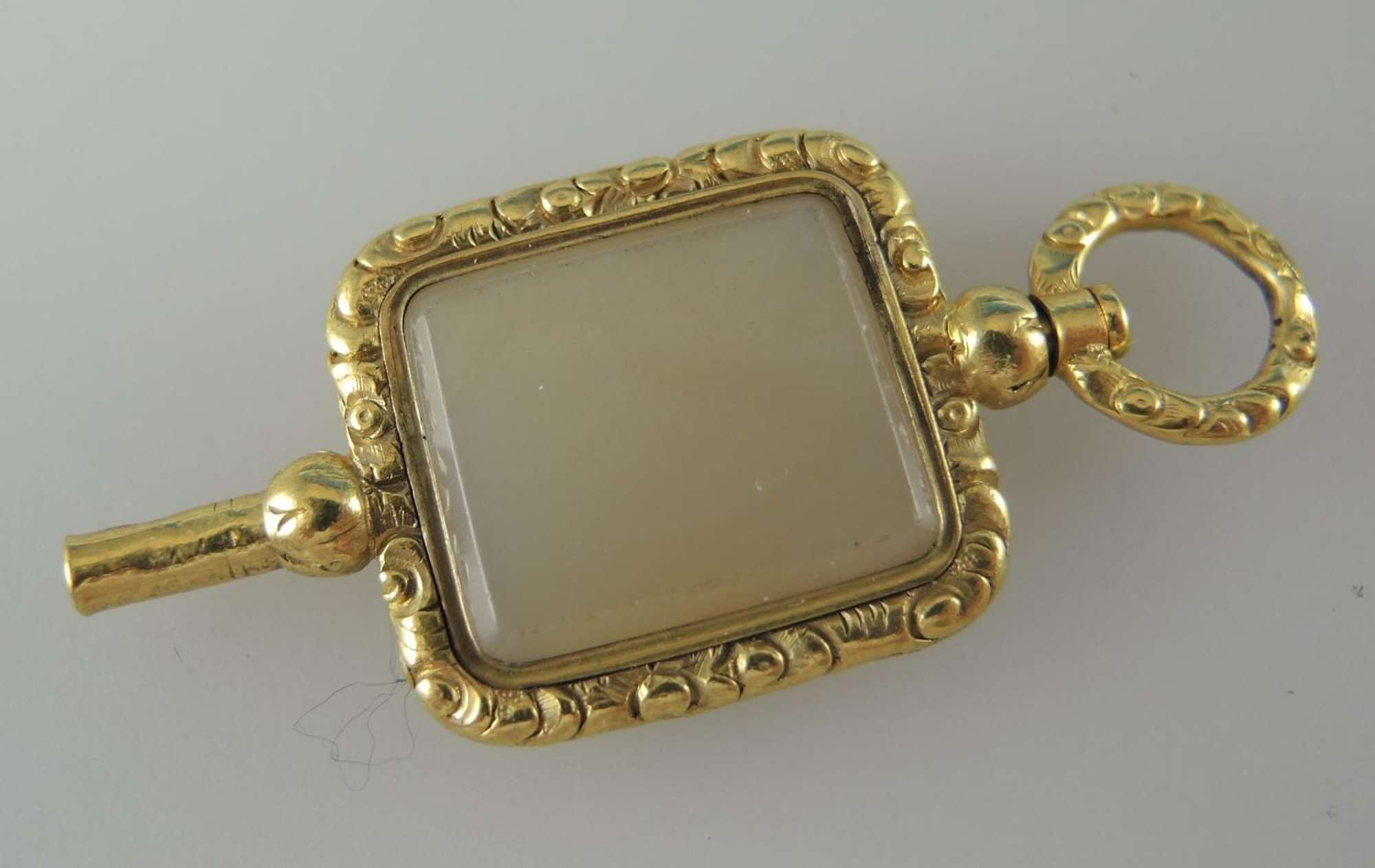 Fancy Gilt and White Stone Set Pocket Watch Key. Circa 1850