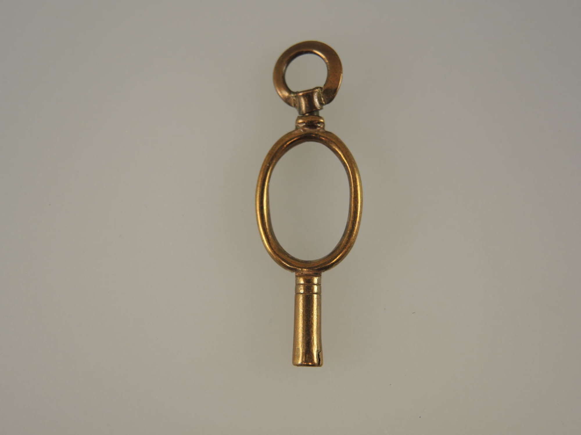 Gilt metal early Oval watch key c1800