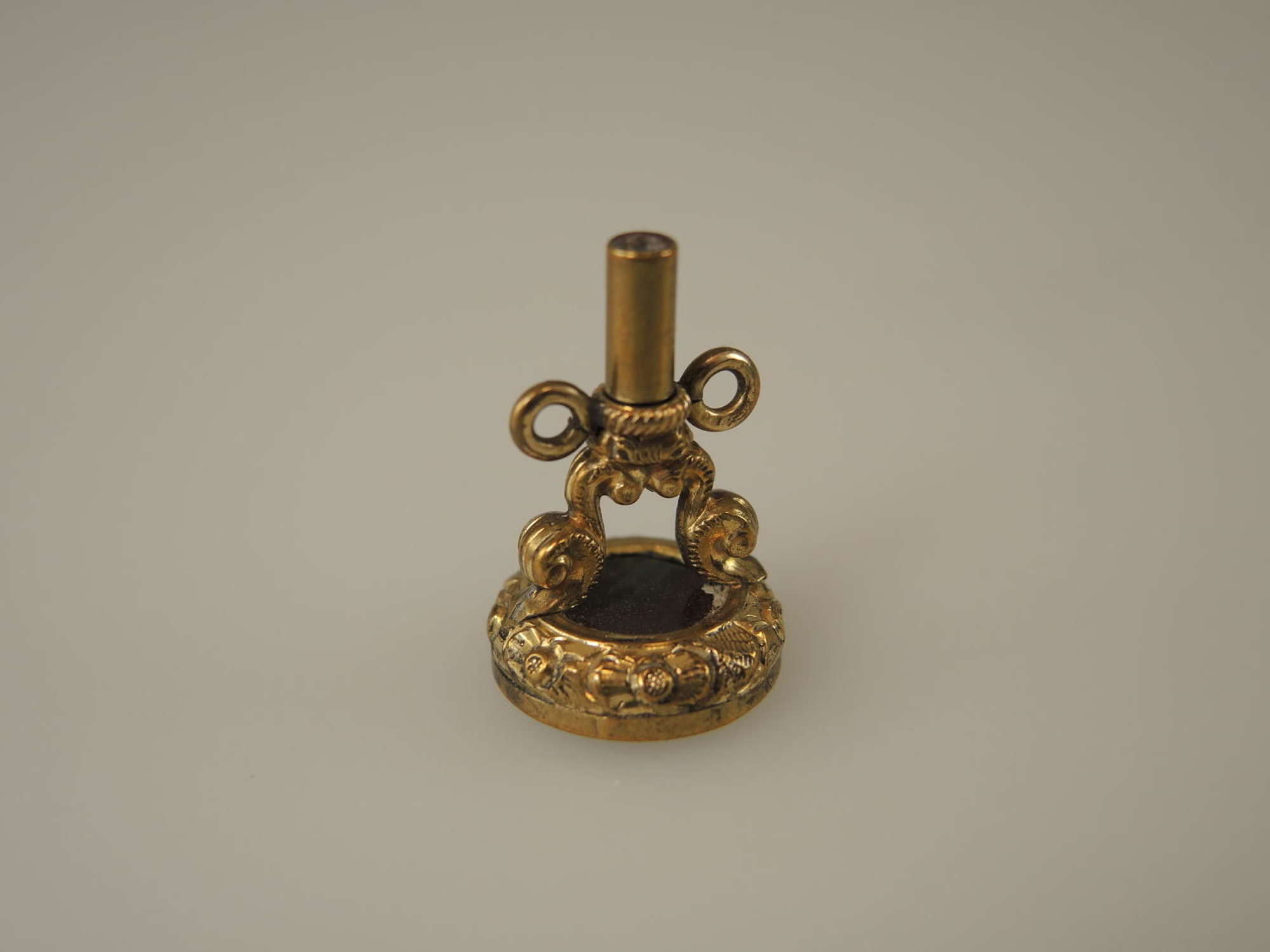 Gilt metal seal and pocket key with intaglio carved stone base c1850