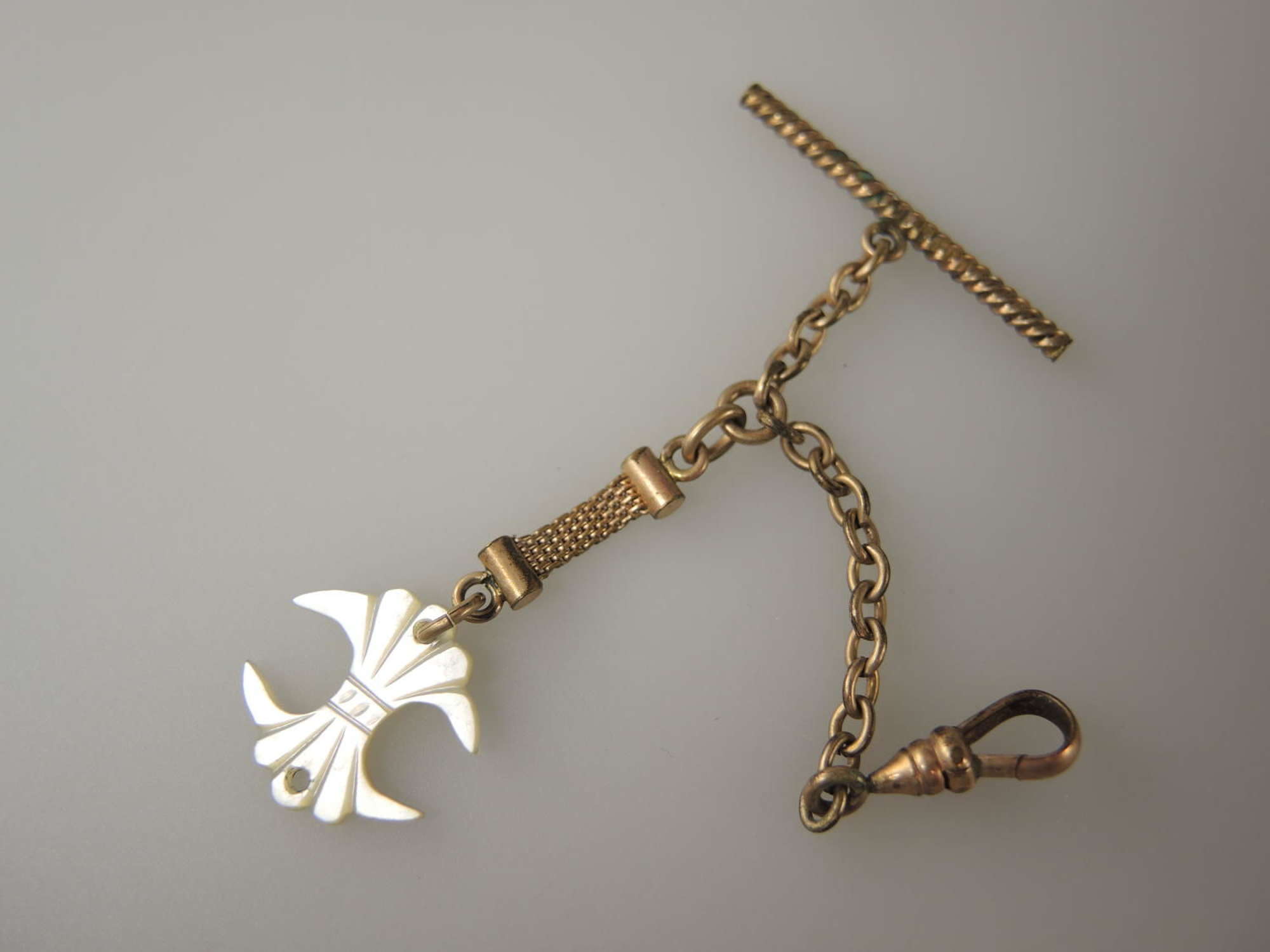 Gilt Watch Chain with a Mother of Pearl Fob. Circa 1890