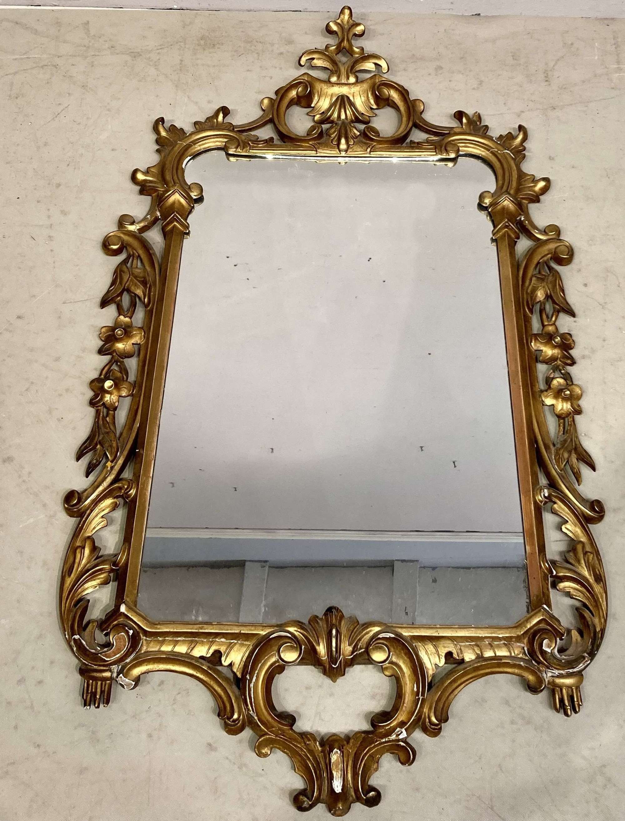 Chippendale style carved giltwood wall mirror.
