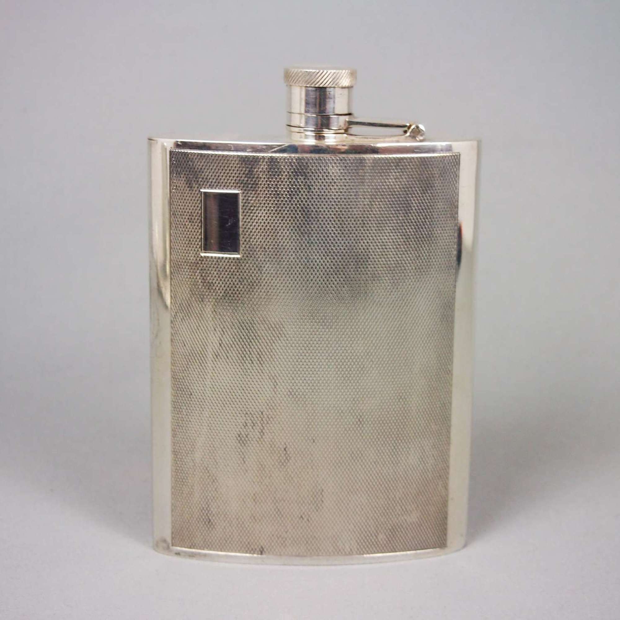 Vintage engine turned silver plated whisky flask. W8503
