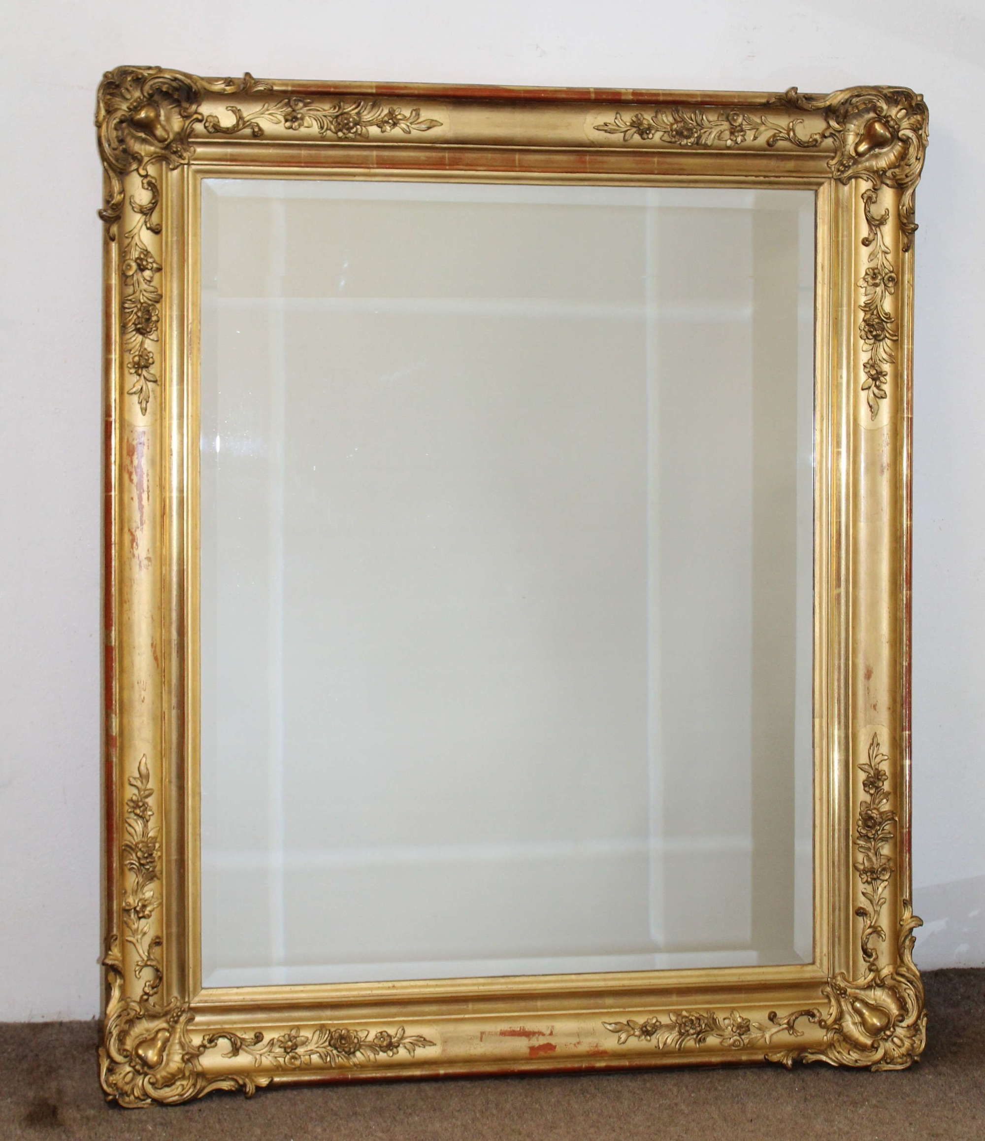 Antique French swept corner gilt mirror