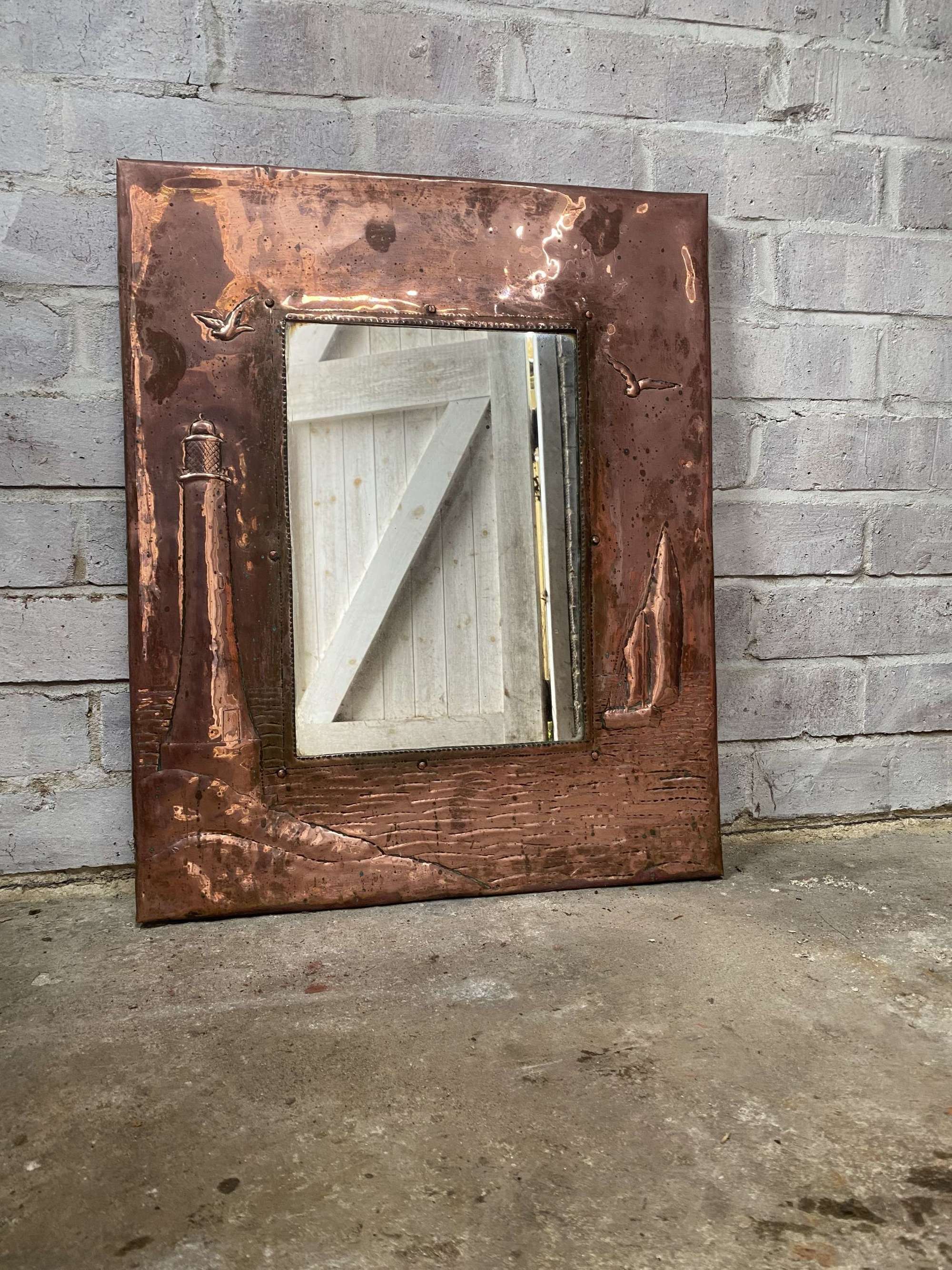 A Newlyn Arts & Crafts Copper Mirror.