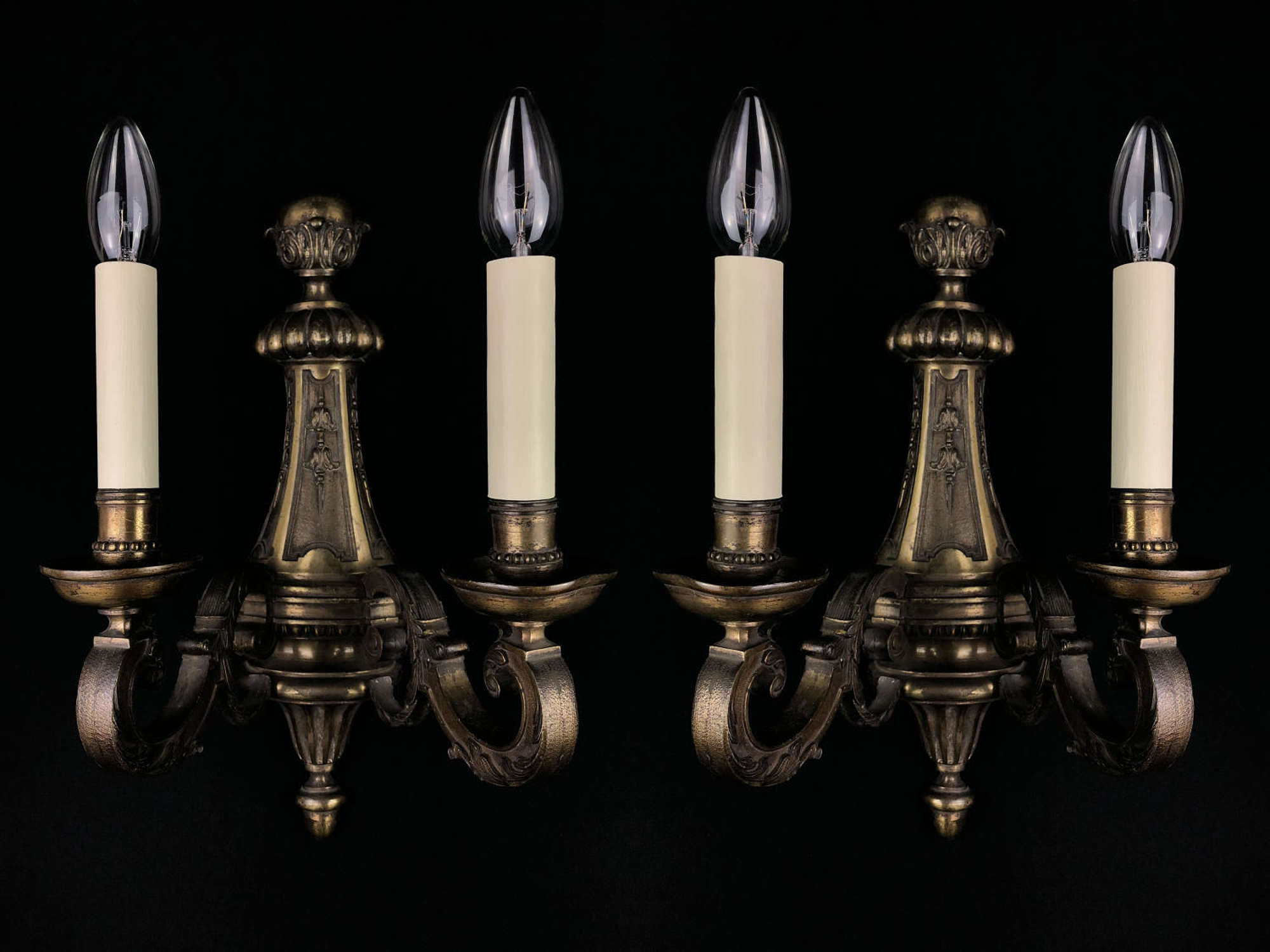 A set of four large Regency style wall lights