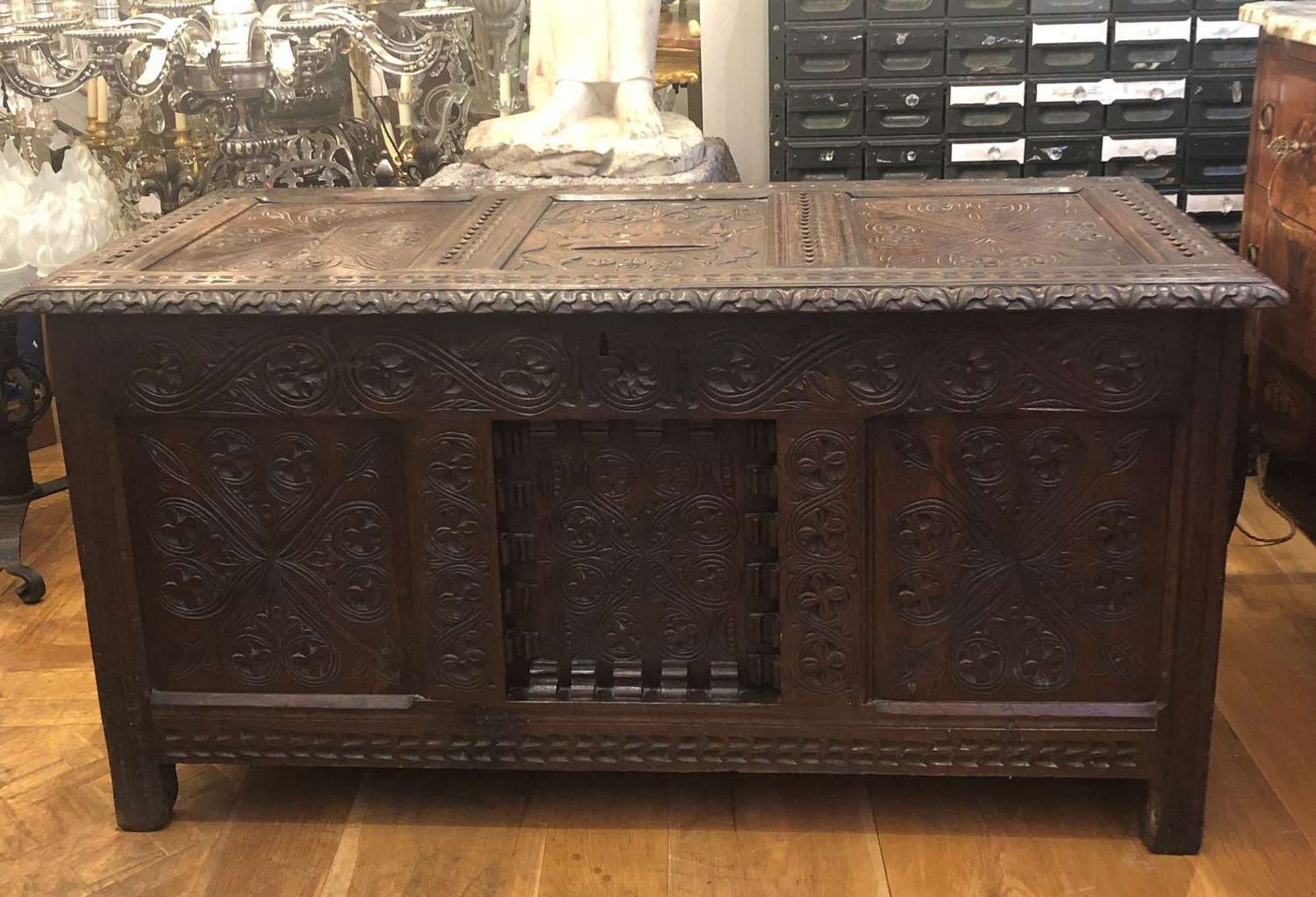 An oak panelled carved coffer