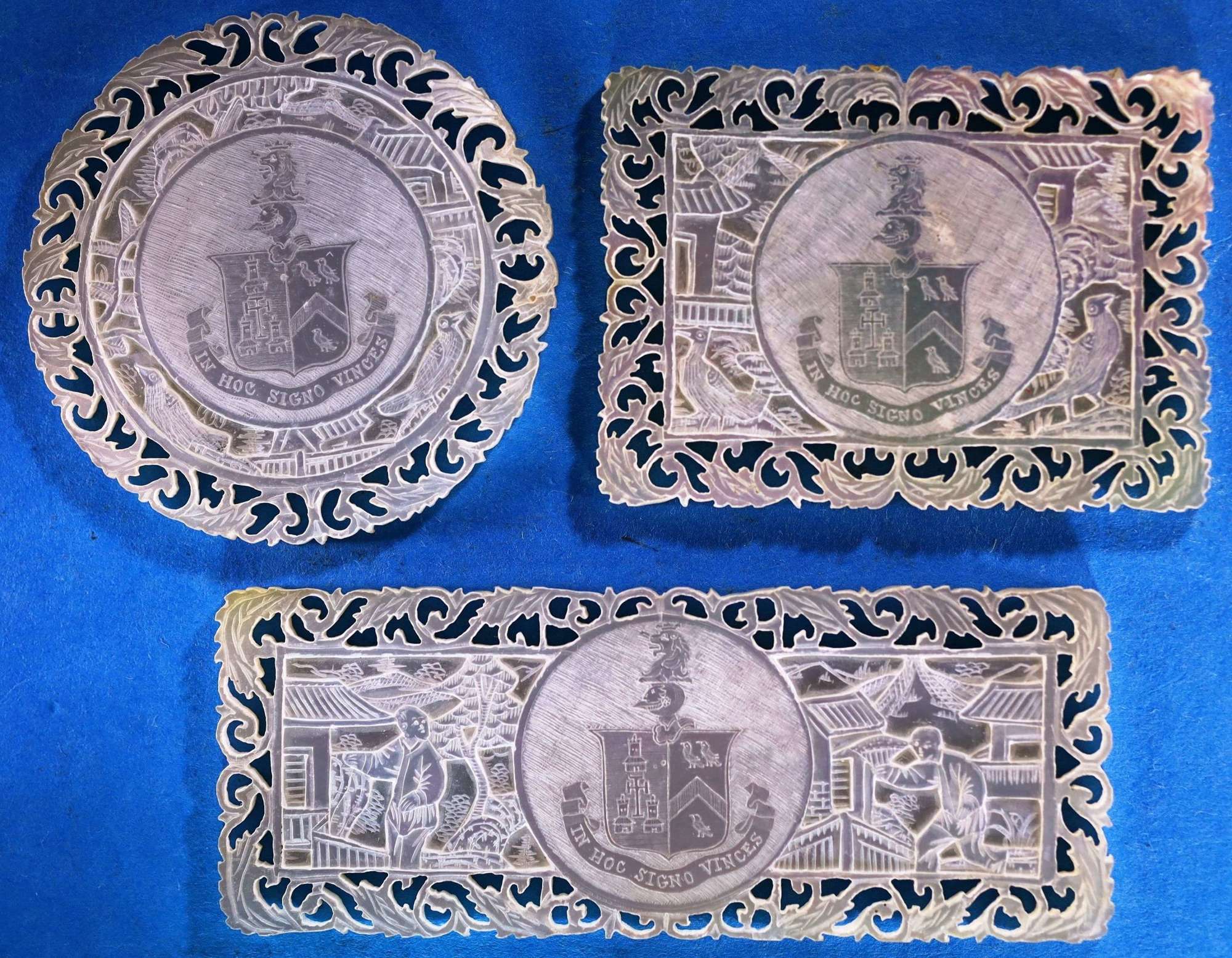 Superb set of three large deep-carved fretted armorials