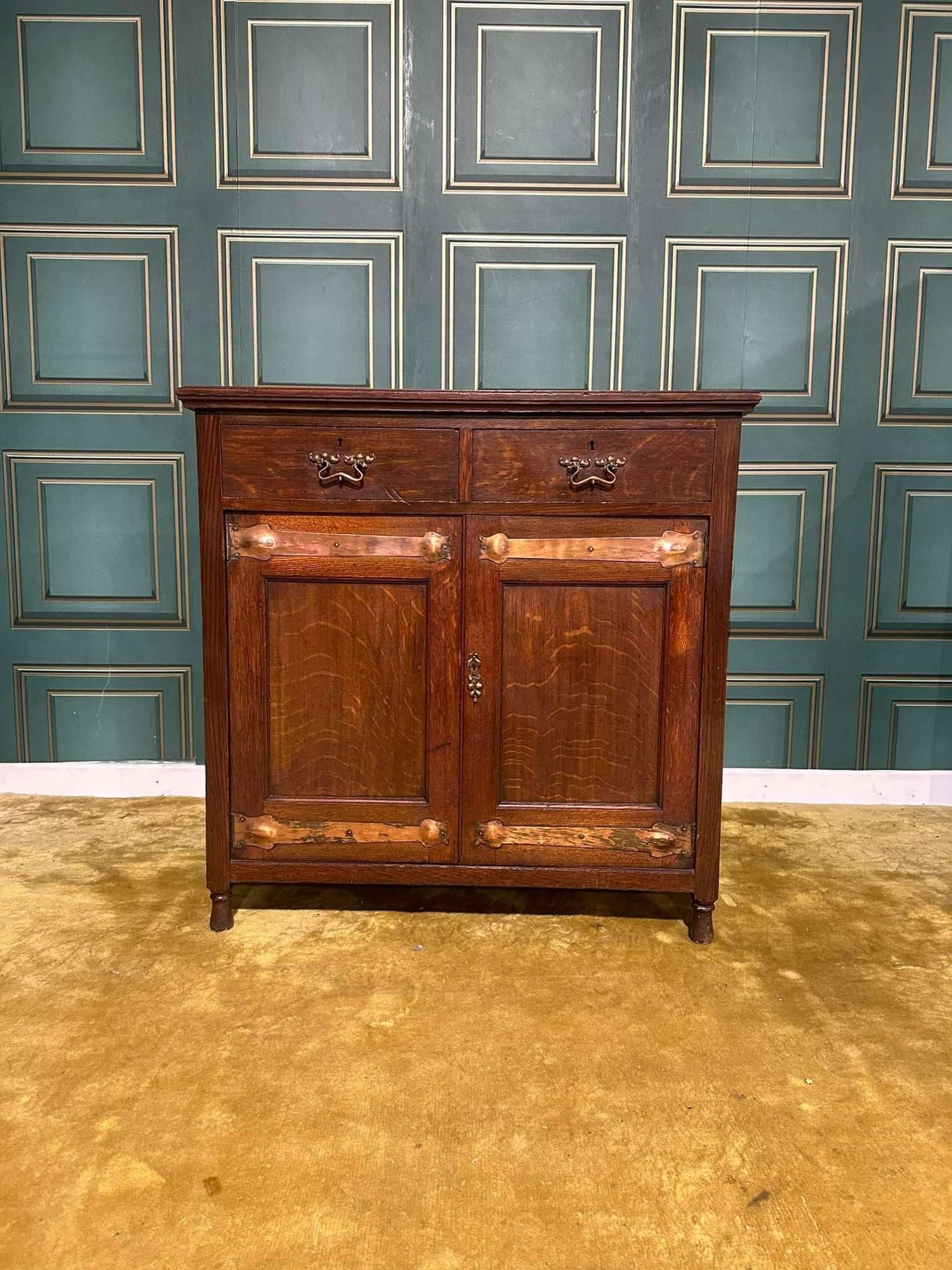Arts & Crafts Cabinet Having Two Drawers With Very Decorative Copper Handles