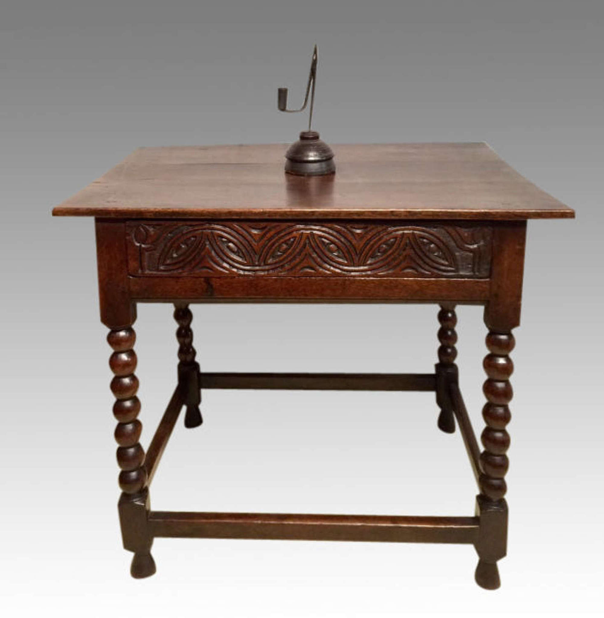 A Charles II antique oak side table.