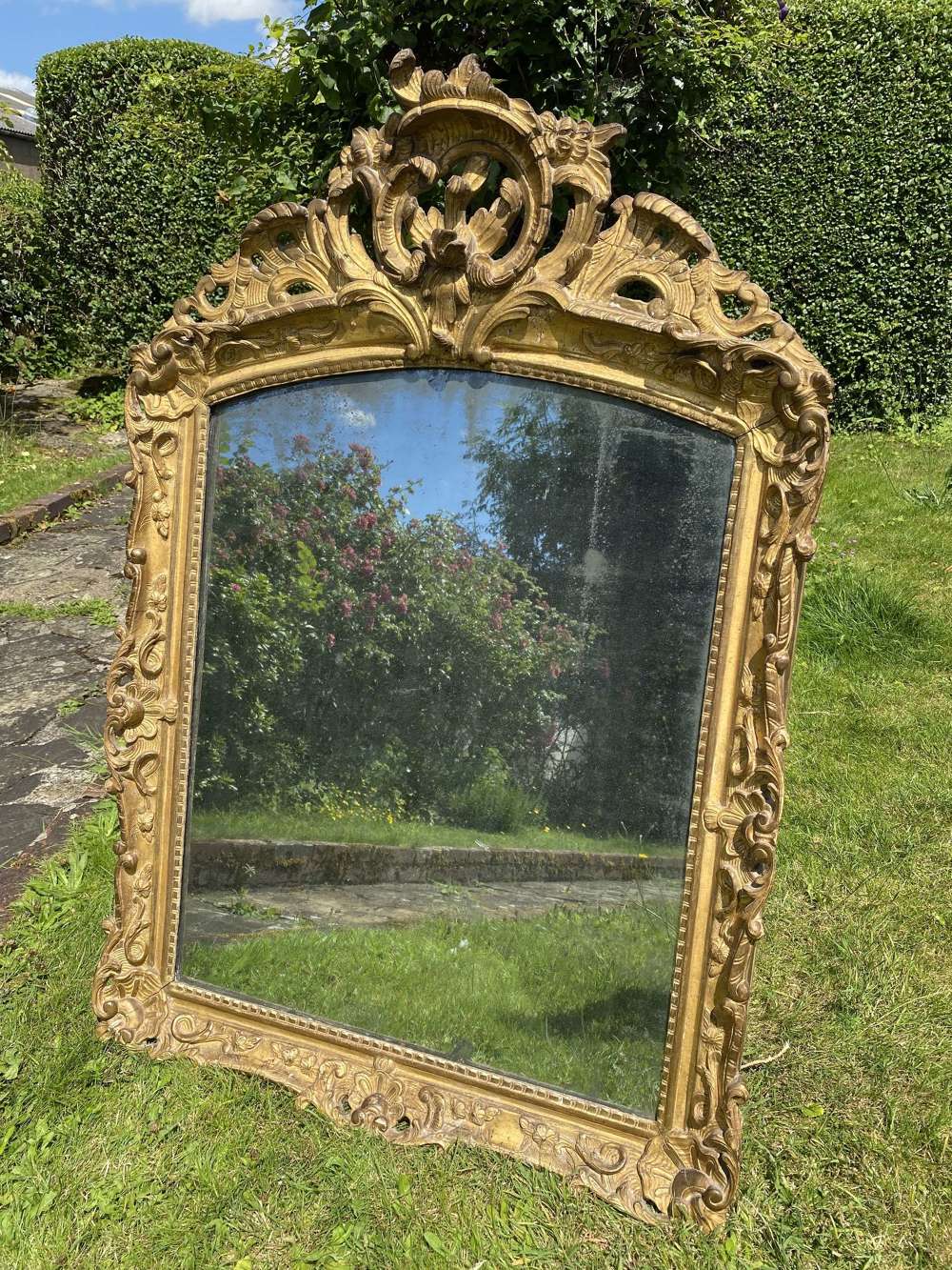 An 18th Century carved giltwood Rococo mirror