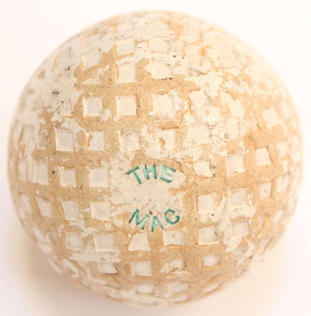 A Mac square mesh vintage golf ball