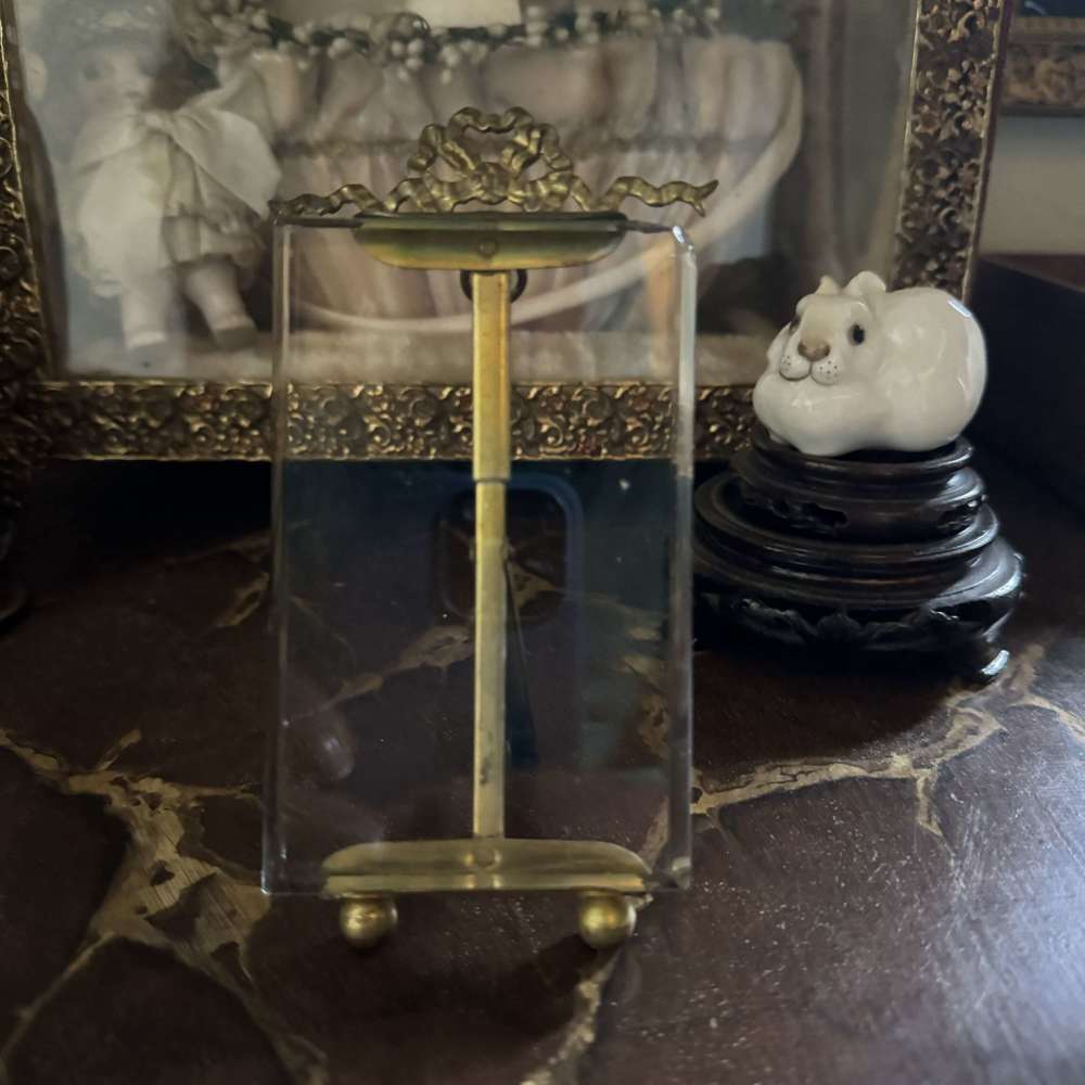 Antique French gilded decorative bow top frame
