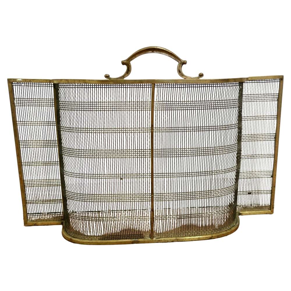 A Victorian Bowed Brass Nursery Fire Guard   A Victorian antique fire guard