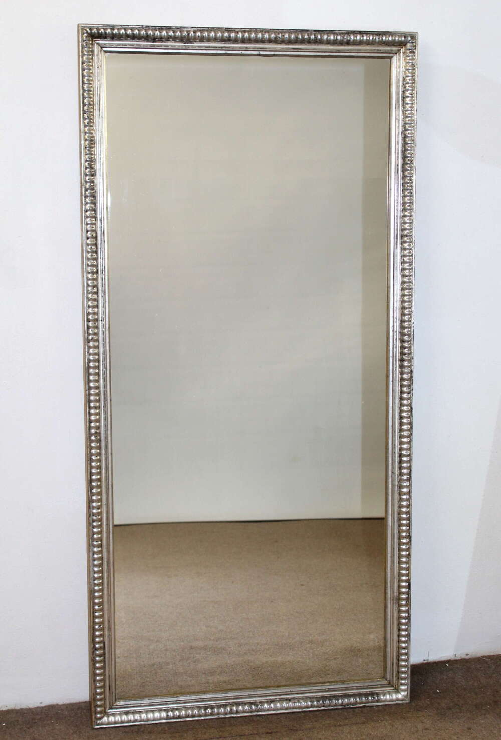 Antique French silverleafed mirror with partly decorative frame