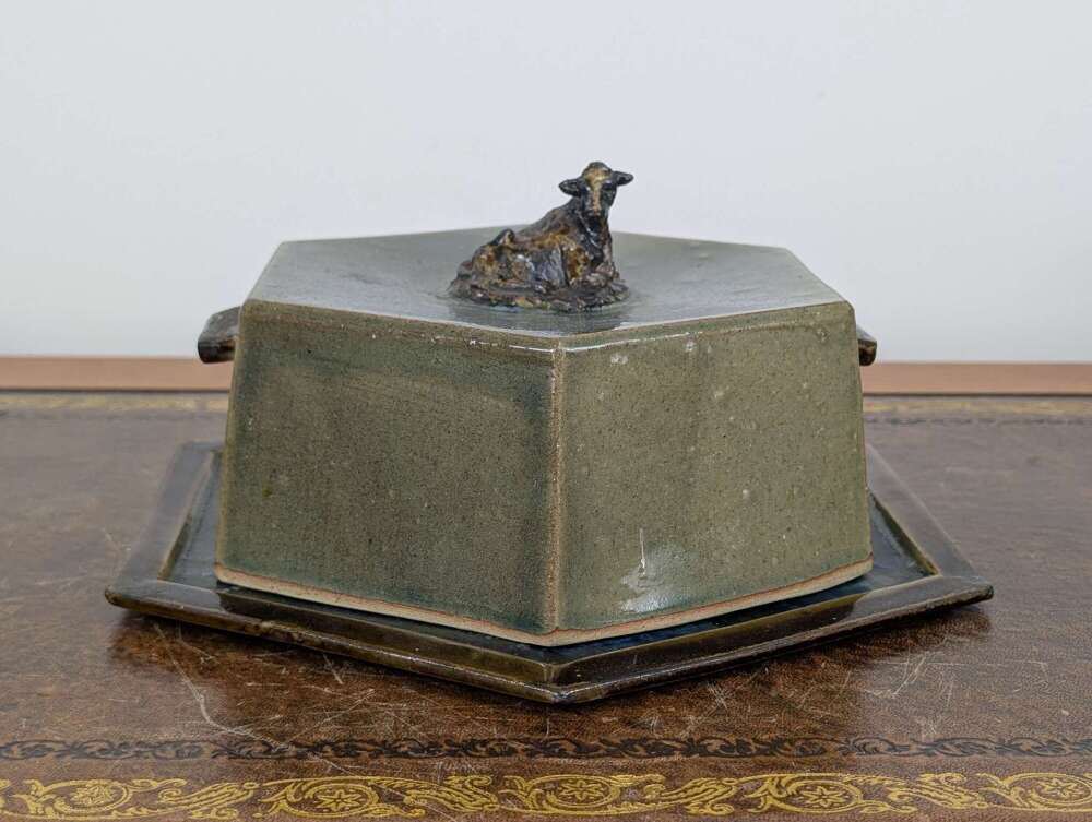 Studio pottery butter or cheese dish with cow lid, hexagonal green glaze, signed V.W.