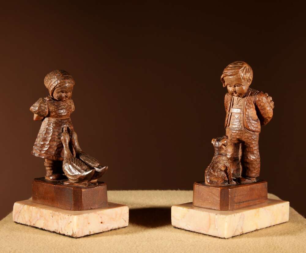  Black Forest Original Pair Of Fine Carved Sculptures Of A Boy And Girl.