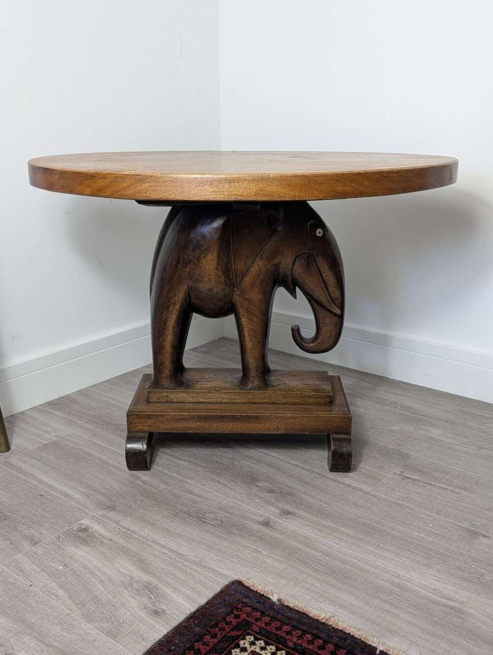 Akan wooden table with carved elephant base, West African, mid 20th century