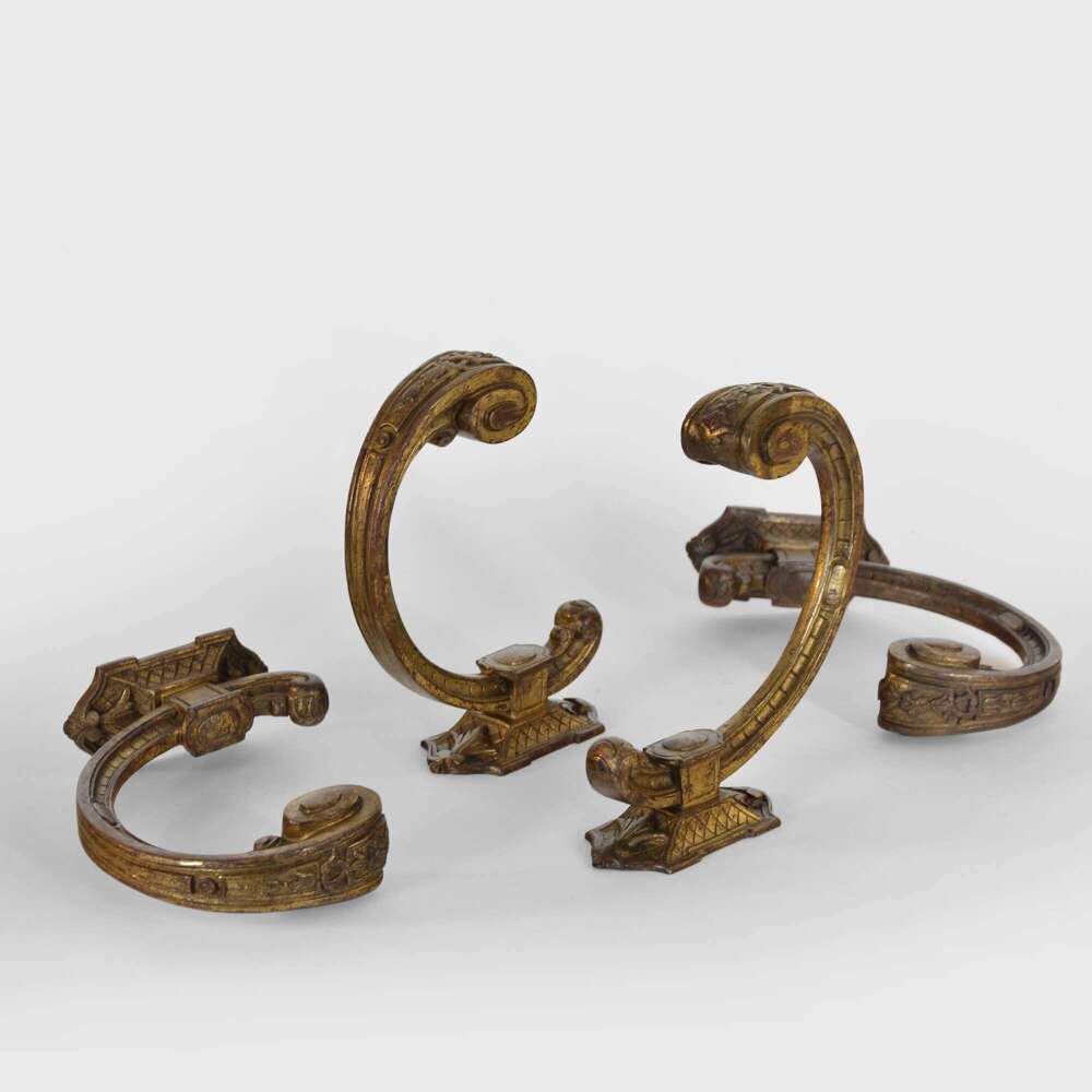 Two pairs of French ormolu curtain tie backs