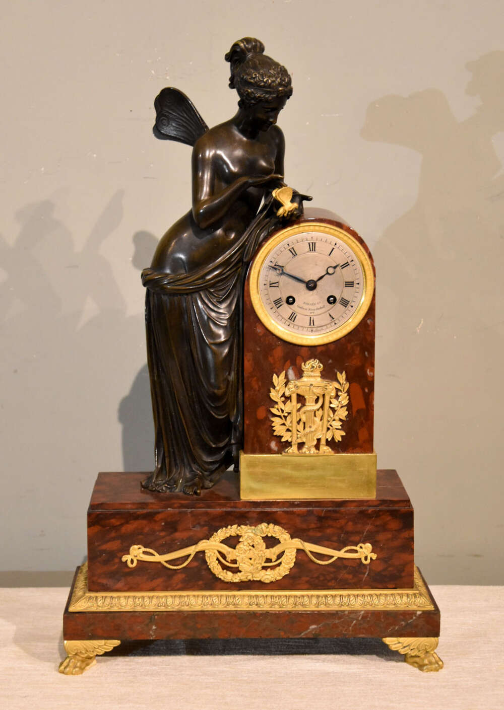 A&nbsp;French bronze and red marble mantel clock